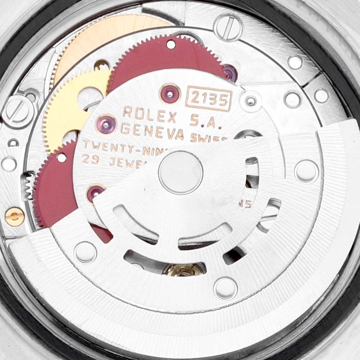 This image shows a close-up view of the movement inside a Rolex Datejust 69173 Women's Steel and Gold (two tone) White Dial 69173 Women's Steel and Gold (two tone) White Dial watch, including gears and the rotor.