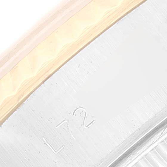 This is a close-up view of the bezel and case of a Rolex Datejust 69173 Women's Steel and Gold (two tone) White Dial 69173 Women's Steel and Gold (two tone) White Dial watch.