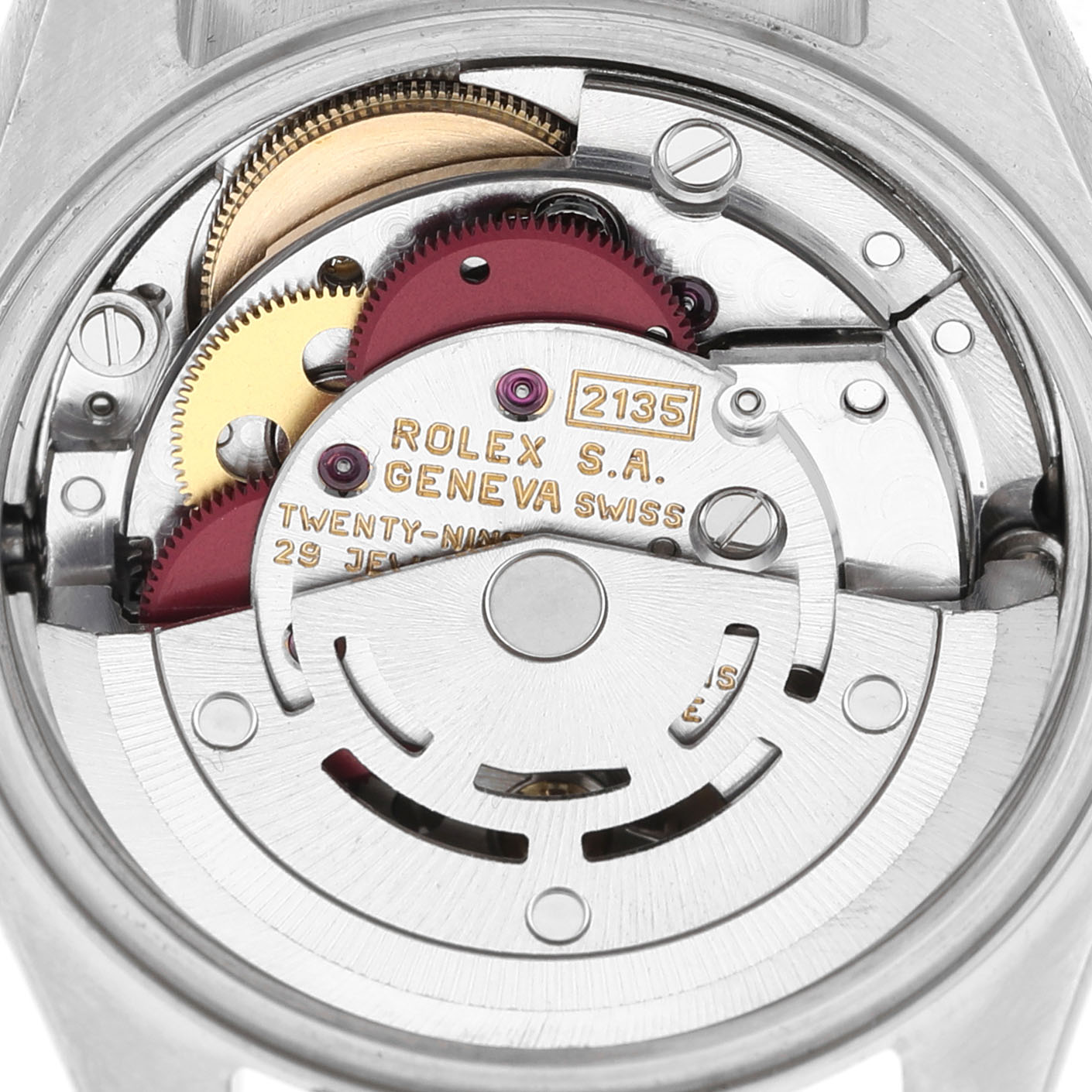 This image shows the movement of a Rolex Datejust 69163 Women's Steel and Gold (two tone) Beige Dial watch, viewed from the back, highlighting gears and inscriptions.