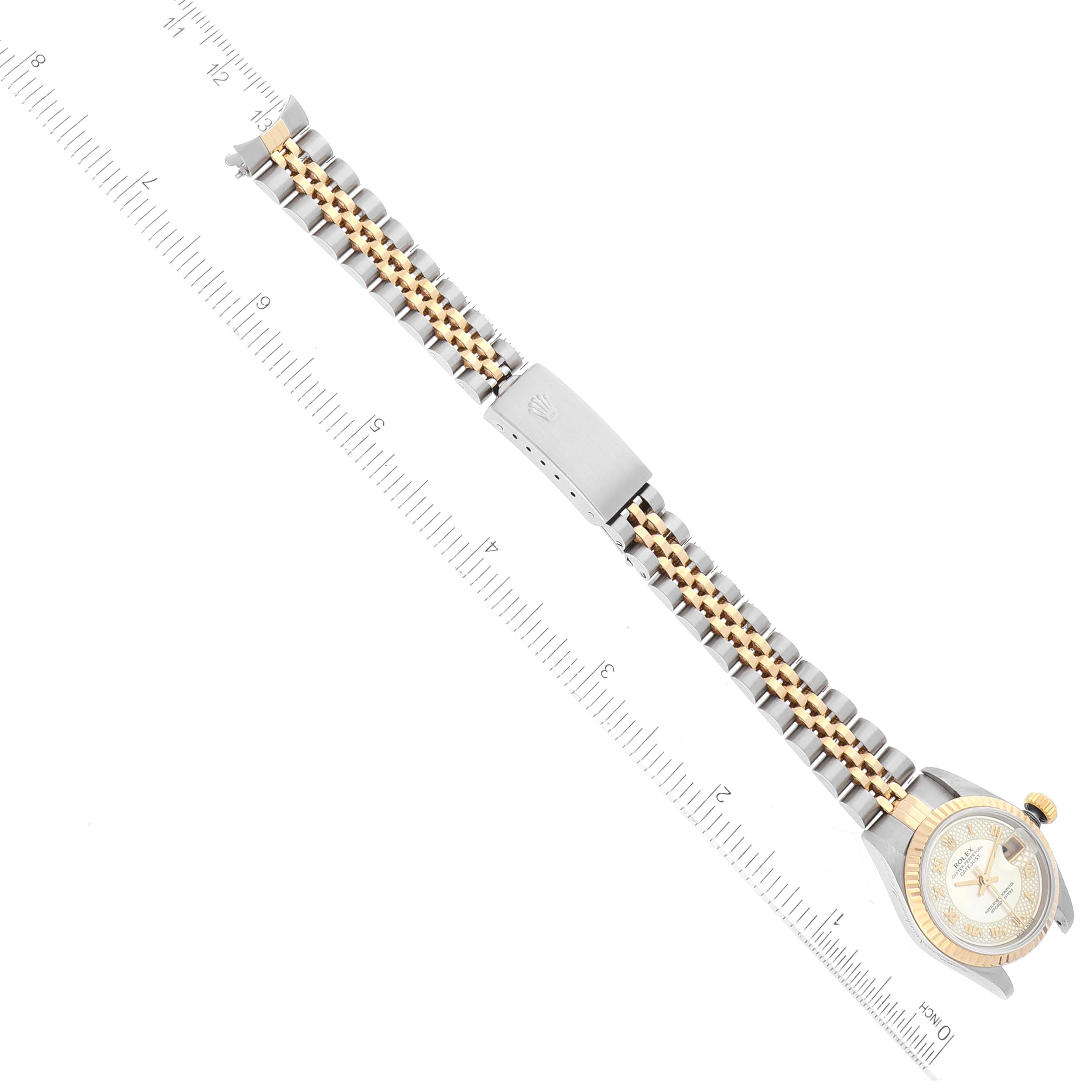 This image shows a Datejust model by Rolex viewed from the top, displaying its full bracelet and clasp alongside a ruler for scale.