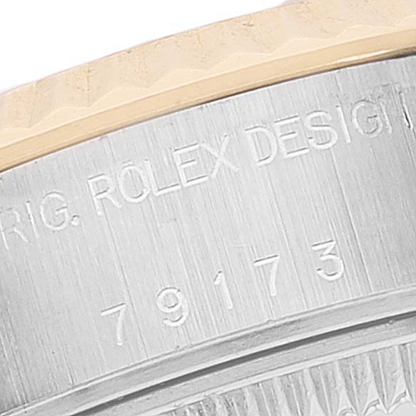 This image shows a close-up of the case side and serial number of a Rolex Datejust 79173 Women
s Steel and Gold (two tone) Mother of Pearl Dial 79173 Women
s Steel and Gold (two tone) Mother of Pearl Dial watch.