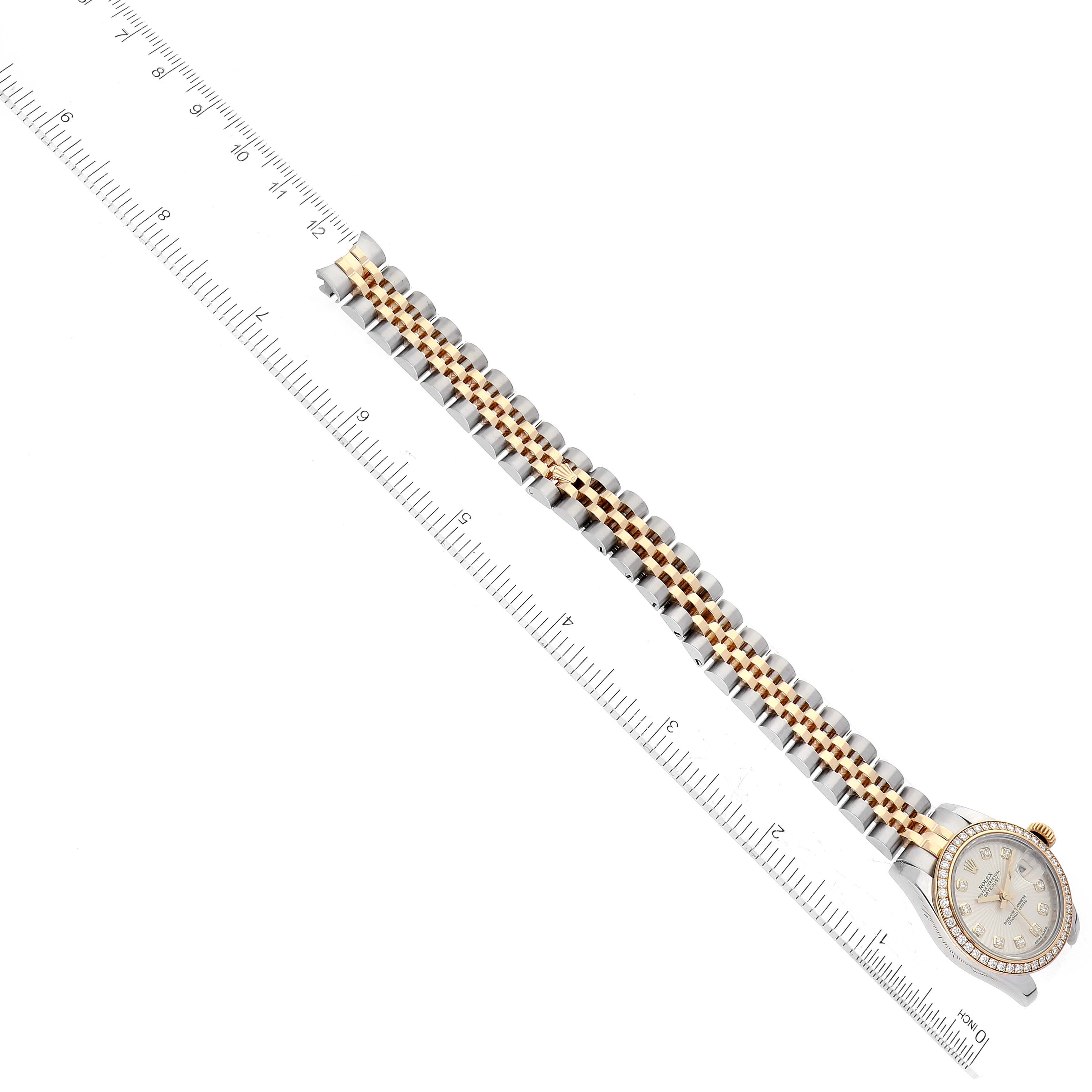 The image shows a top-down view of a Rolex Datejust 179383 Women's Steel and Gold (two tone) Silver Dial 179383 Women's Steel and Gold (two tone) Silver Dial watch with its band laid out next to a ruler, displaying the band's length.