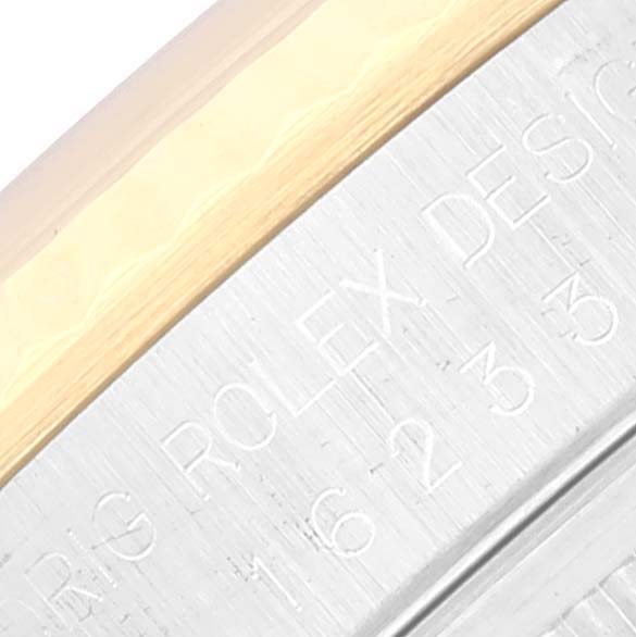 This image shows a close-up view of the side engraving on a Rolex Datejust 16233 Men's Steel and Gold (two tone) White Dial 16233 Men's Steel and Gold (two tone) White Dial watch, highlighting the model number and part of the bezel.