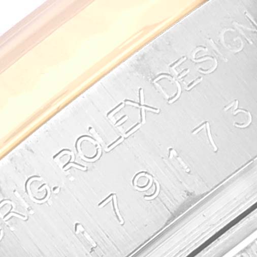 The image shows a close-up of the engraved serial number and branding on the case side of a Rolex Datejust 179173 Women's Steel and Gold (two tone) White Dial 179173 Women's Steel and Gold (two tone) White Dial watch.
