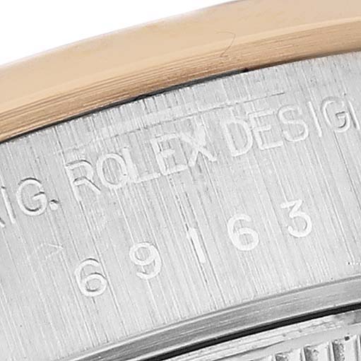 The image shows a close-up of the Rolex Datejust 69163 Women's Steel and Gold (two tone) White Dial 69163 Women's Steel and Gold (two tone) White Dial model's case back with engraved text.