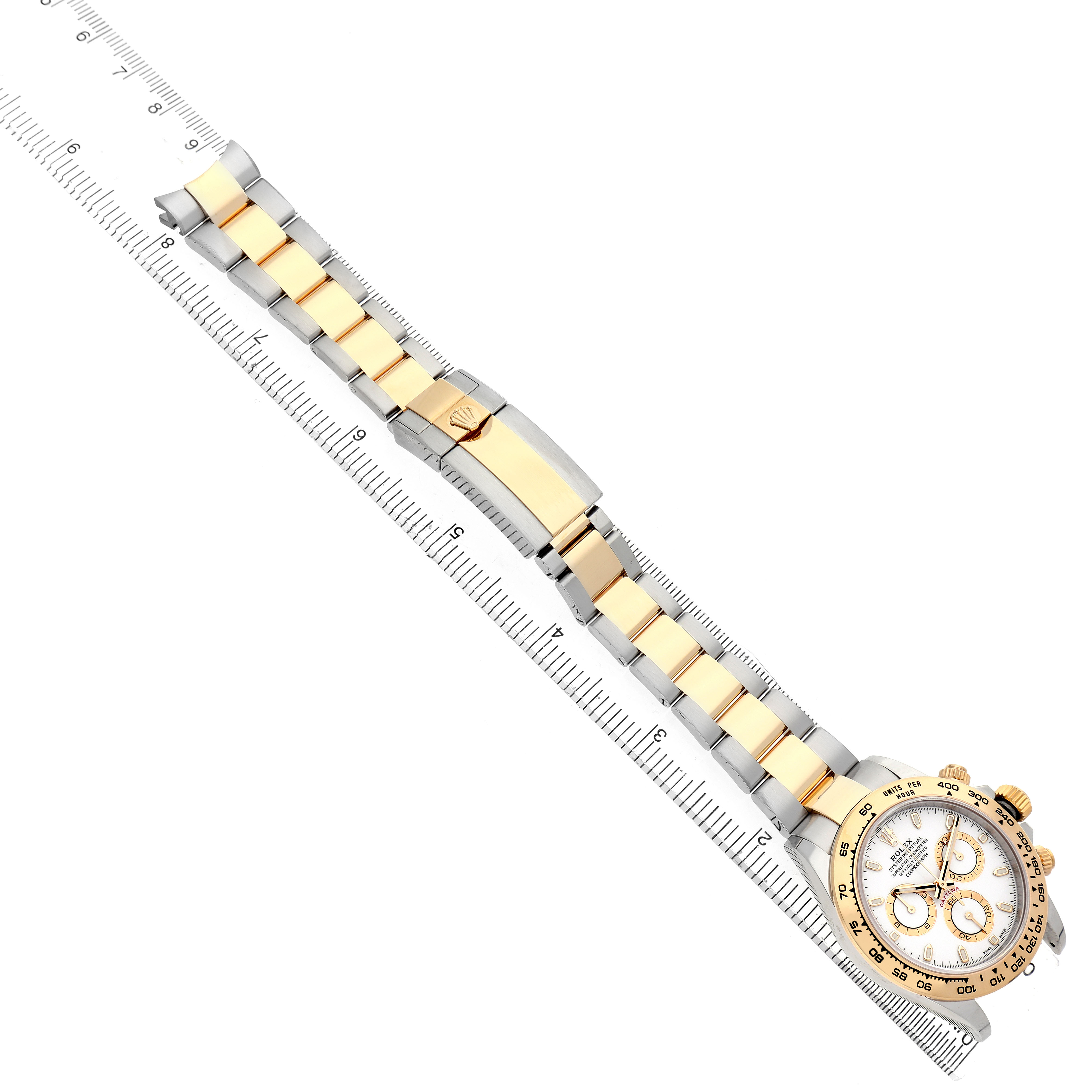 The Rolex Daytona 116503 Men's Steel and Gold (two tone) White Dial watch is shown diagonally from an overhead angle, displaying the face, bezel, and two-tone bracelet.