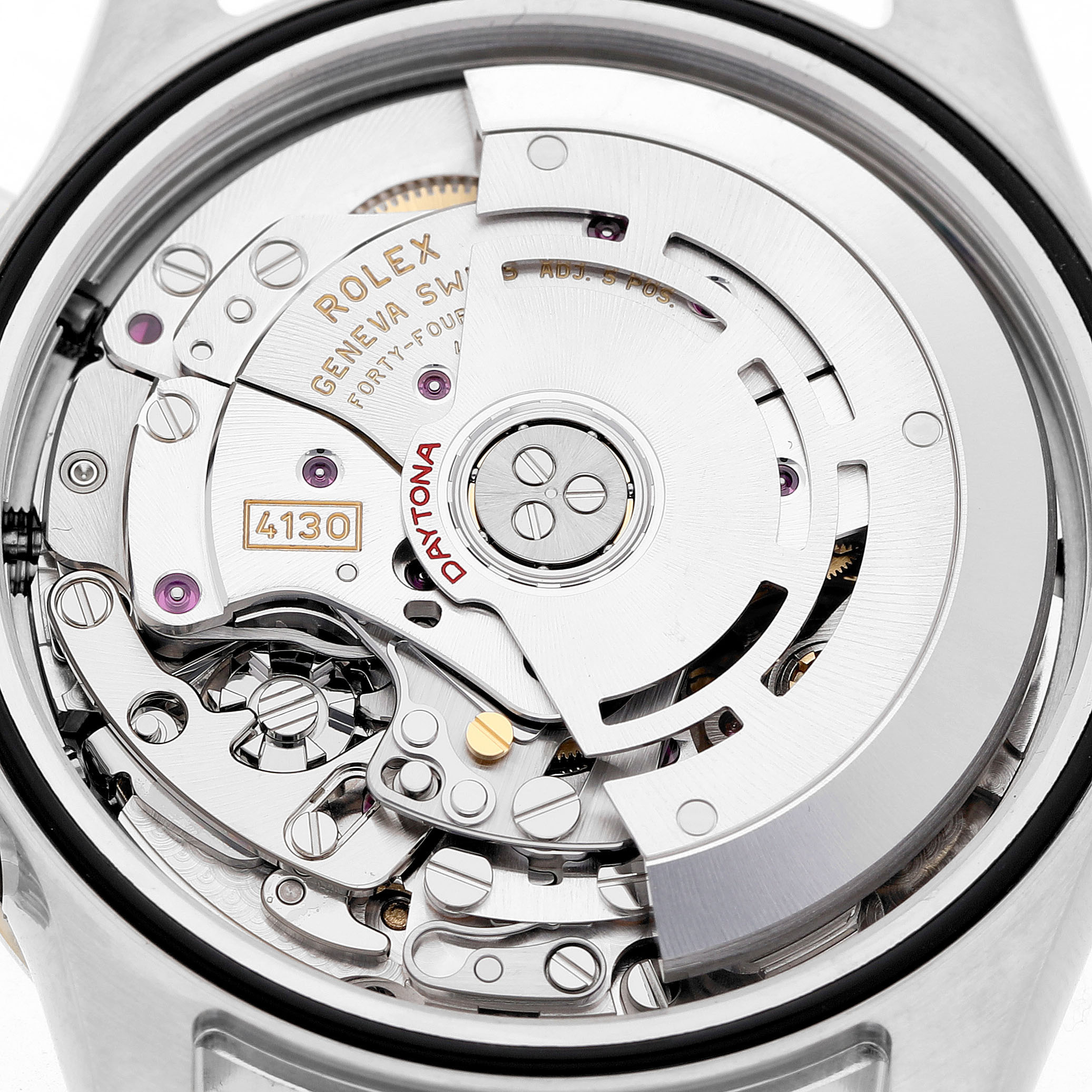 The image shows the movement of a Rolex Daytona 116503 Men's Steel and Gold (two tone) White Dial watch from a back angle, featuring gears and the rotor.