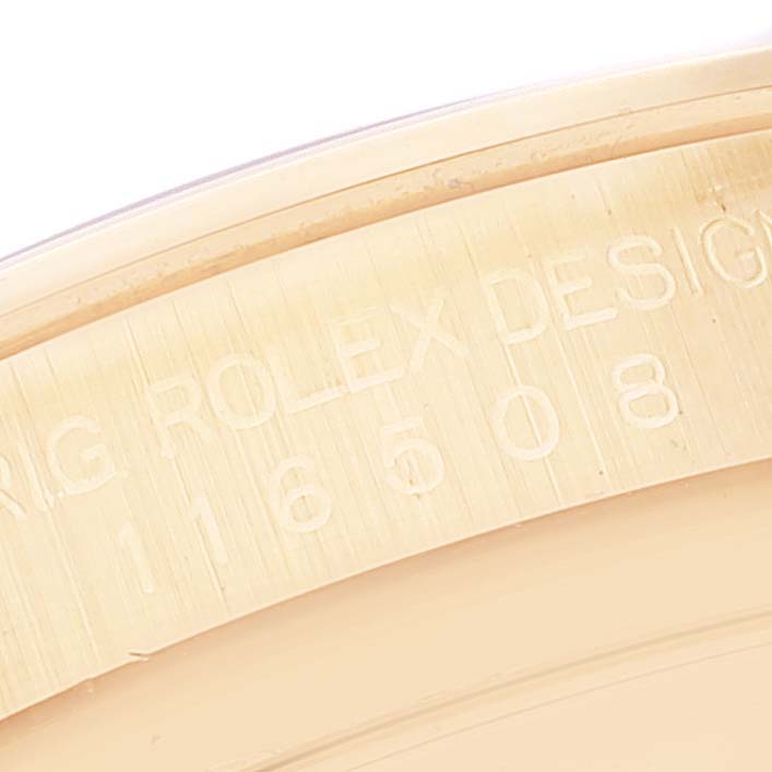 This image shows a close-up of the engraved inner bezel of a Rolex Daytona 116508 Men
s Yellow Gold Green Dial 116508 Men
s Yellow Gold Green Dial watch.