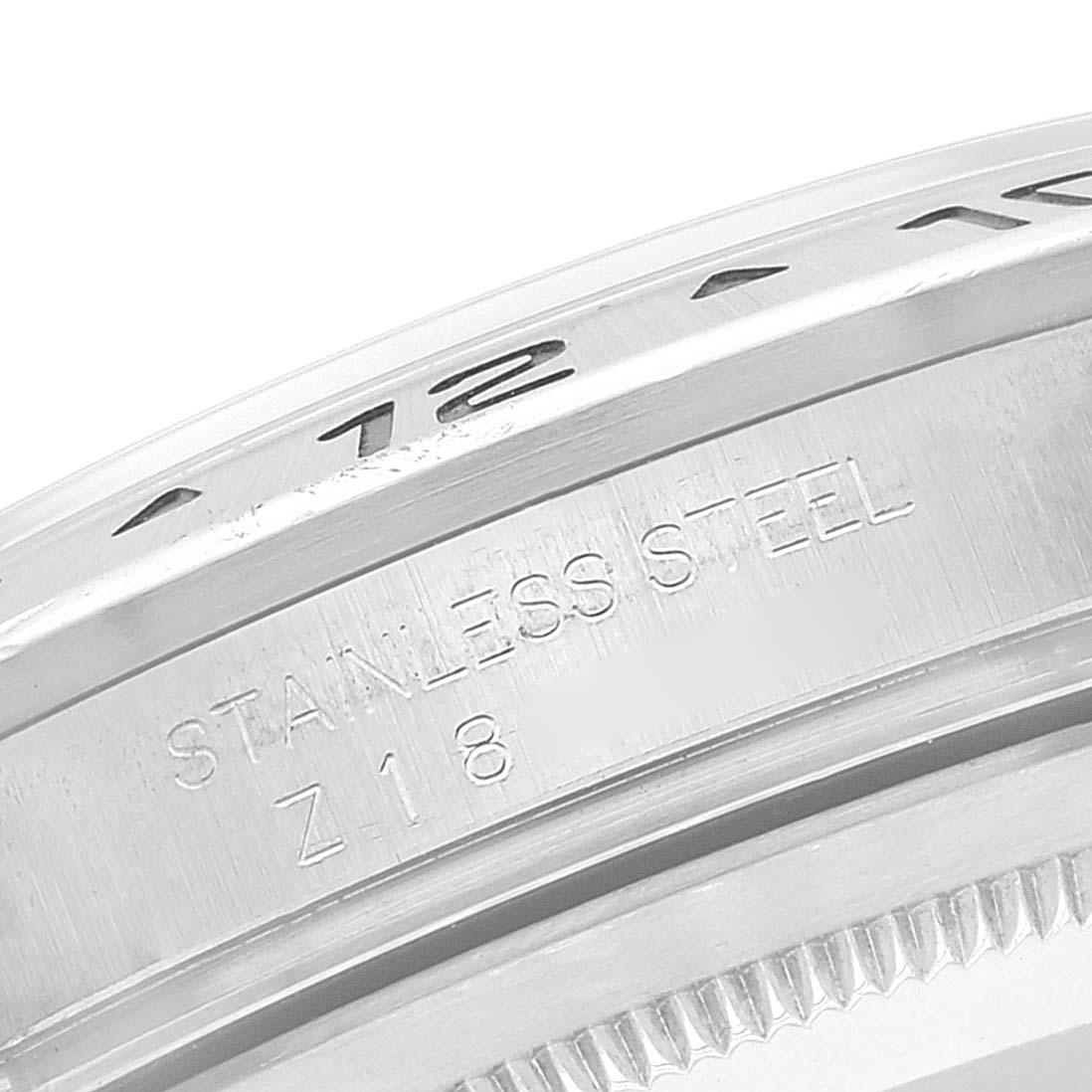 This image shows a close-up of the side of a stainless steel Rolex Explorer 16570 Men
s Stainless Steel Black Dial 16570 Men
s Stainless Steel Black Dial watch, including the bezel and serial number engraving.