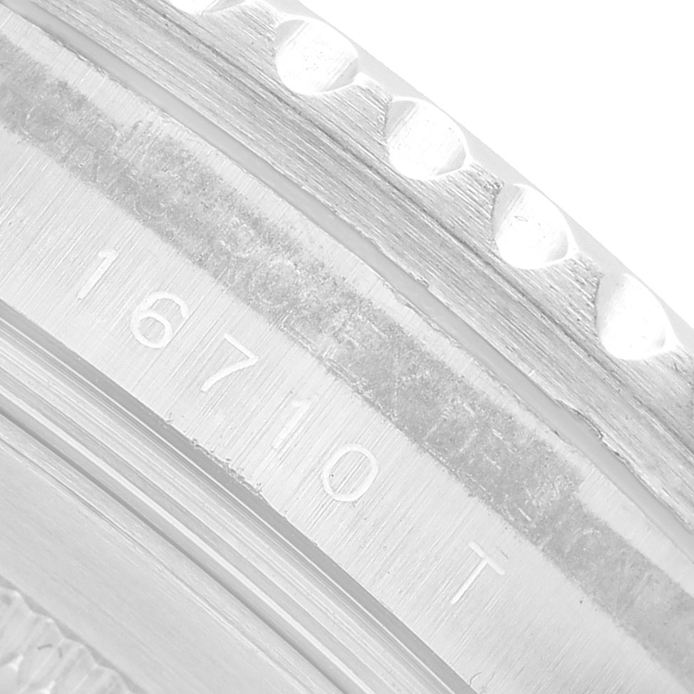 The image shows a close-up of the engraving on the side of the bezel of a Rolex GMT-Master 16710 Men's Stainless Steel Black Dial, model number 16710.