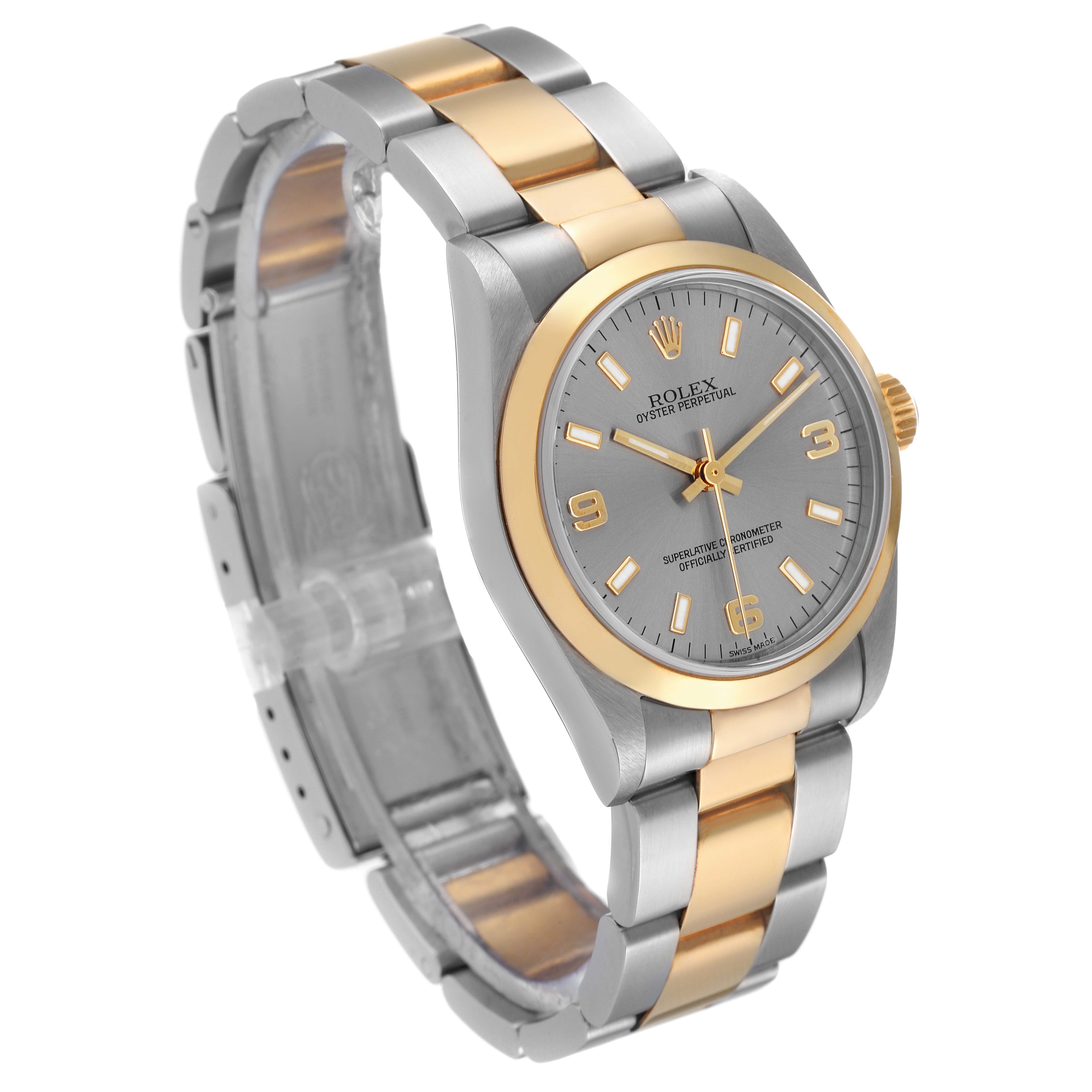 The image shows a Rolex Oyster Perpetual Mid-Size watch at a three-quarter angle, displaying the face, bezel, and bracelet.