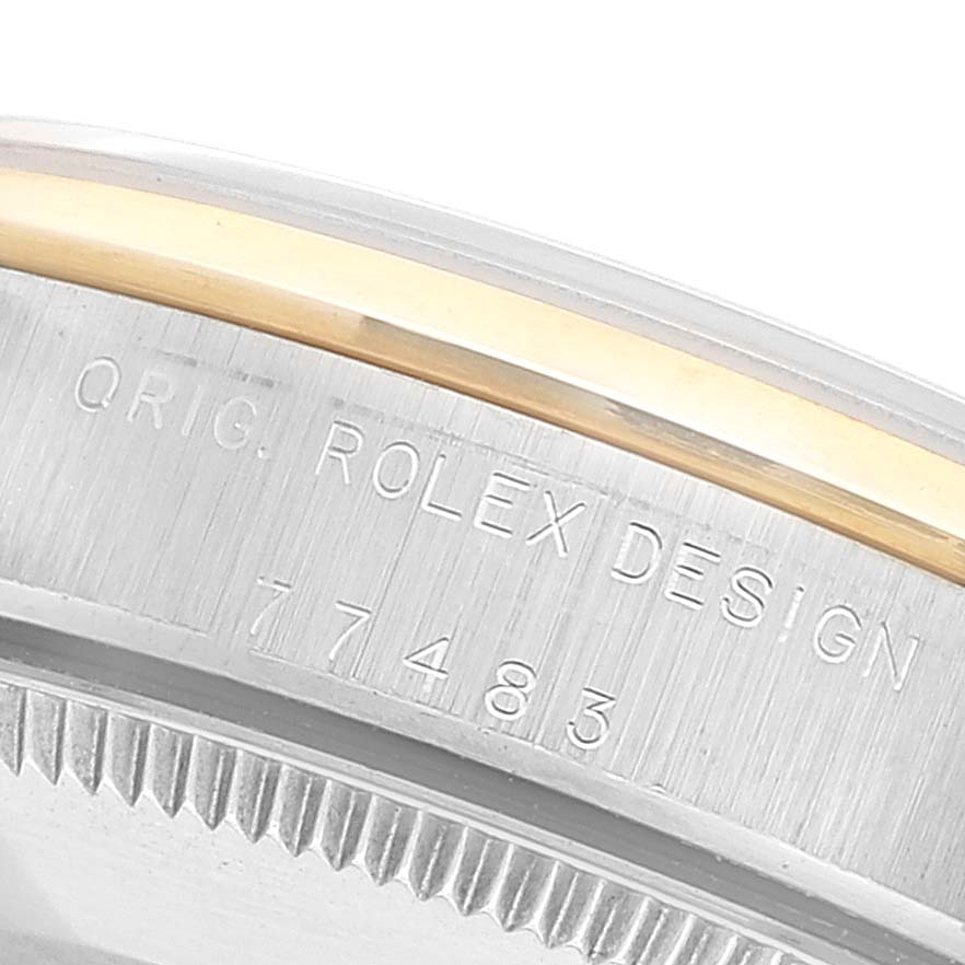 The image shows the engraving on the side of a Mid-Size Rolex watch case, indicating "ORIG. ROLEX DESIGN 77483".