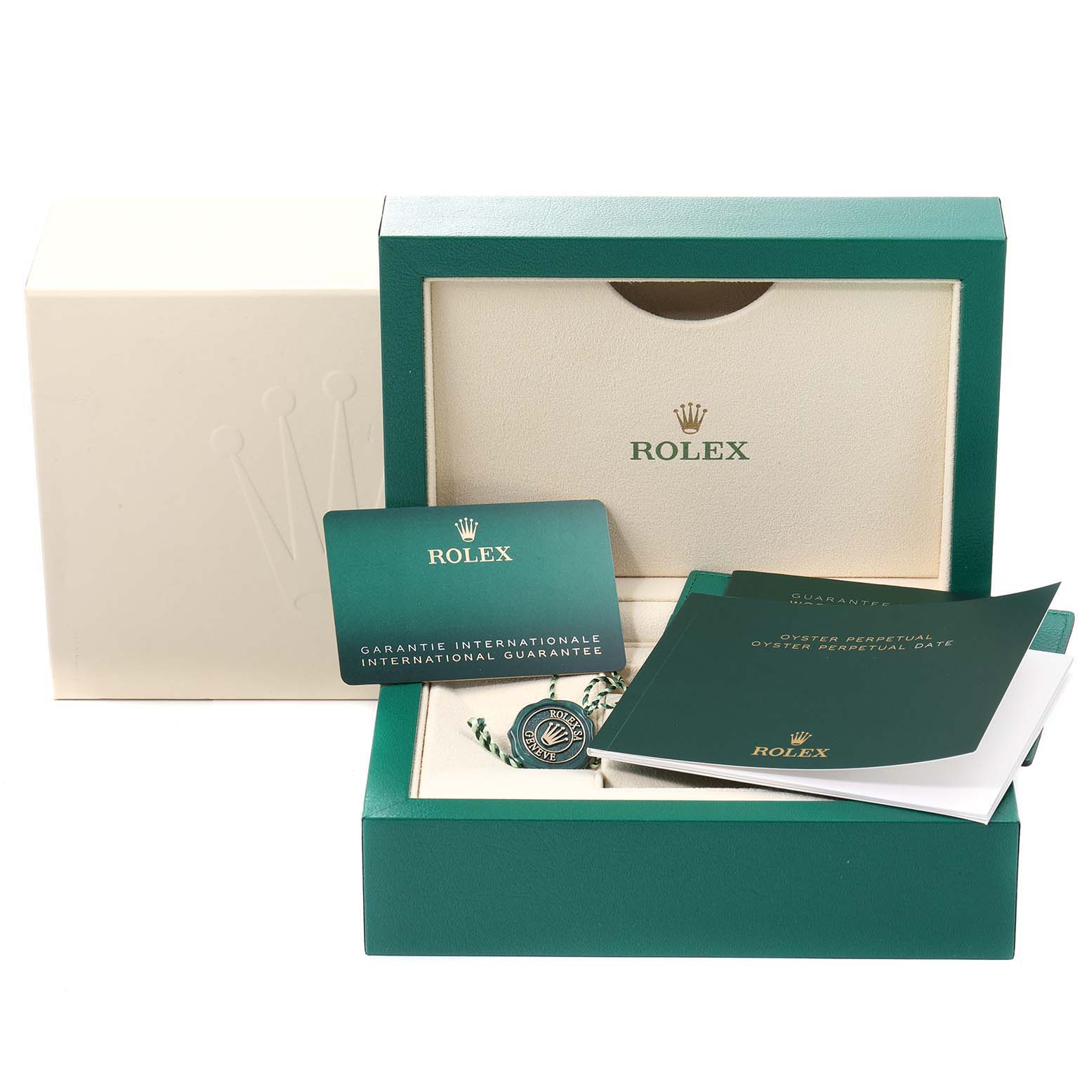 The image shows the packaging and accessories of a Rolex Oyster Perpetual 124200 Men's Stainless Steel Pink Dial 124200 Men's Stainless Steel Pink Dial watch, including booklets, a hang tag, and an international guarantee card.