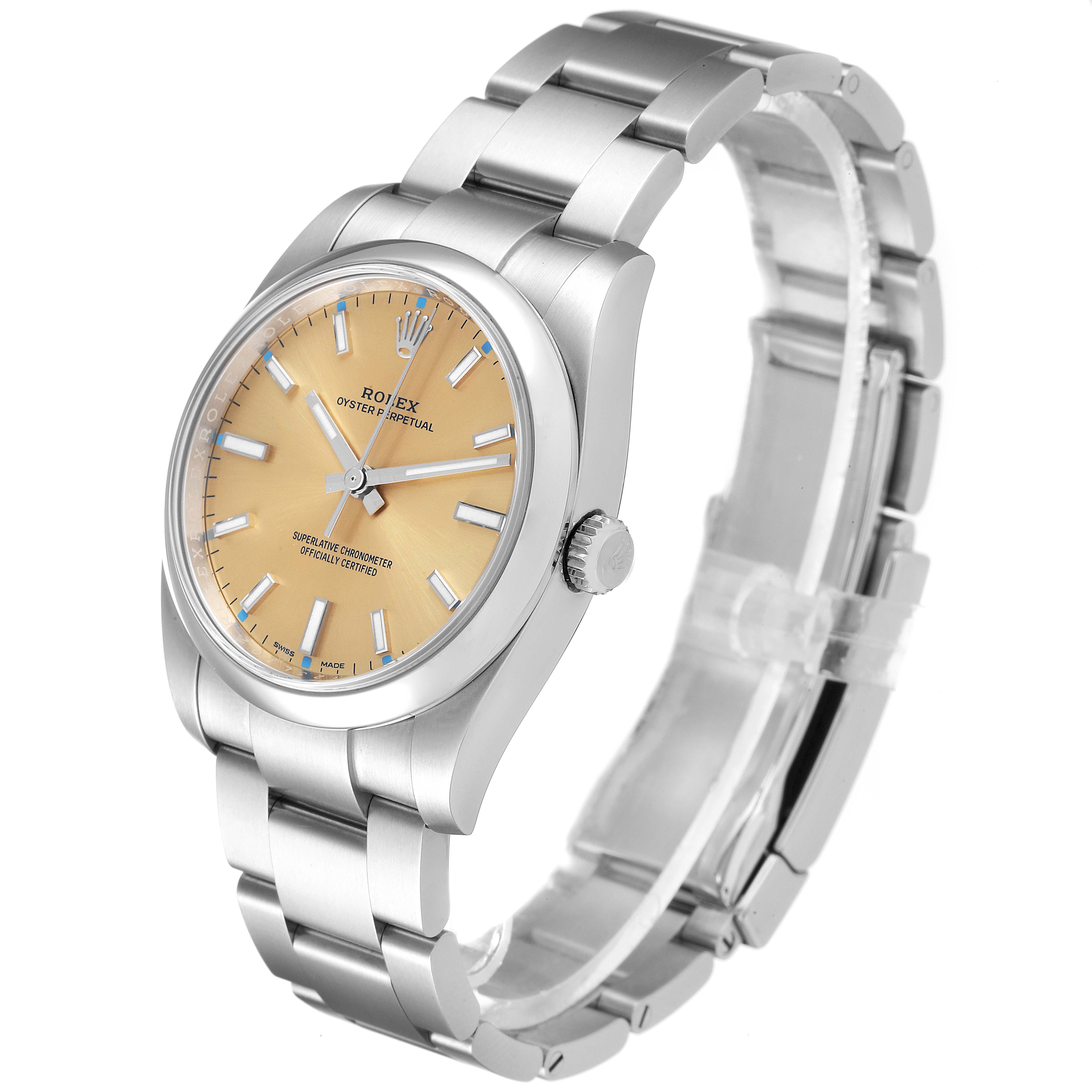 The Rolex Oyster Perpetual 114200 Men's Stainless Steel Champagne Dial 114200 Men's Stainless Steel Champagne Dial watch is shown at a three-quarter angle, displaying the face, bezel, crown, and part of the stainless steel bracelet.