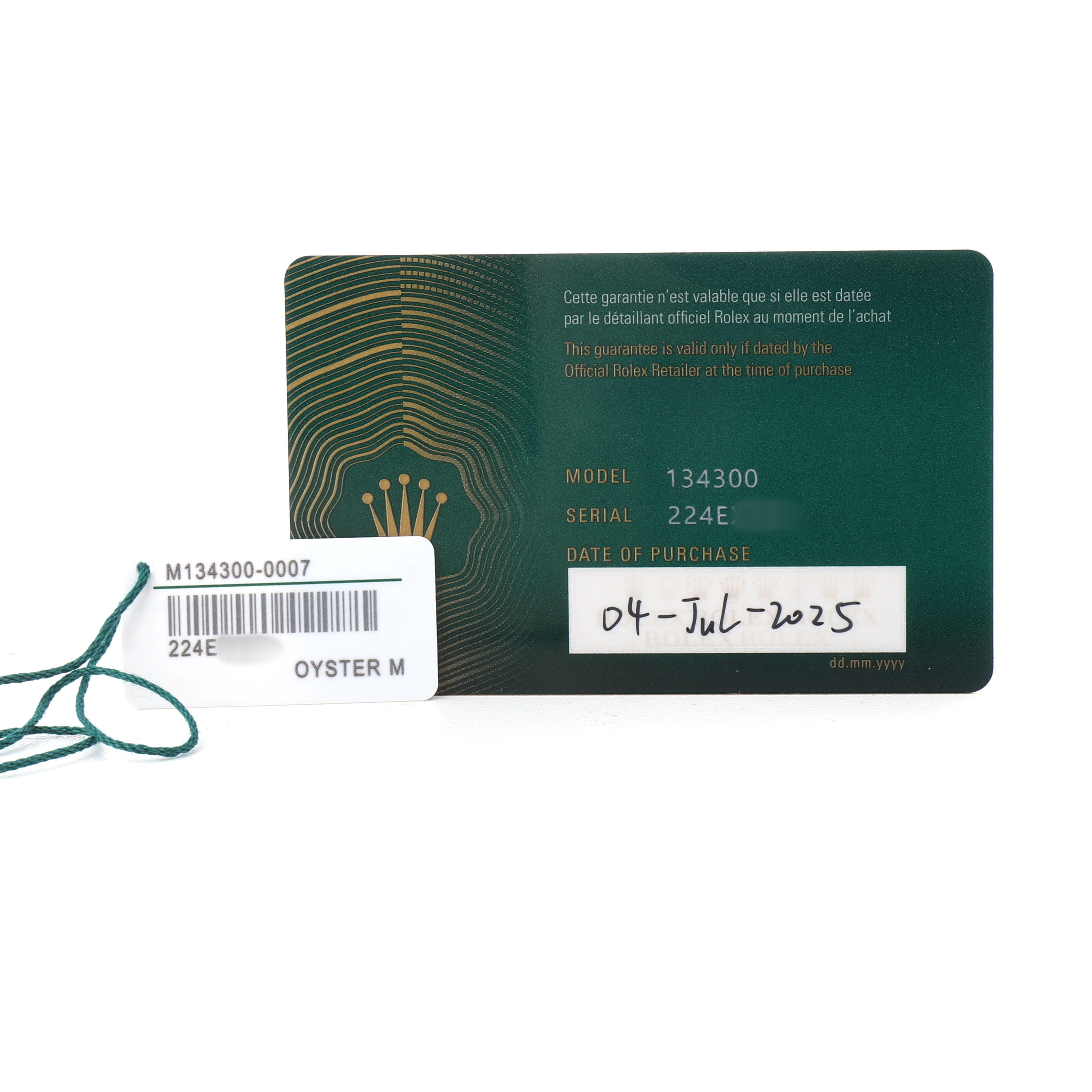 The image shows a warranty card and tag for the Rolex Oyster Perpetual 134300 Men's Stainless Steel Beige Dial watch, displaying model and serial numbers.