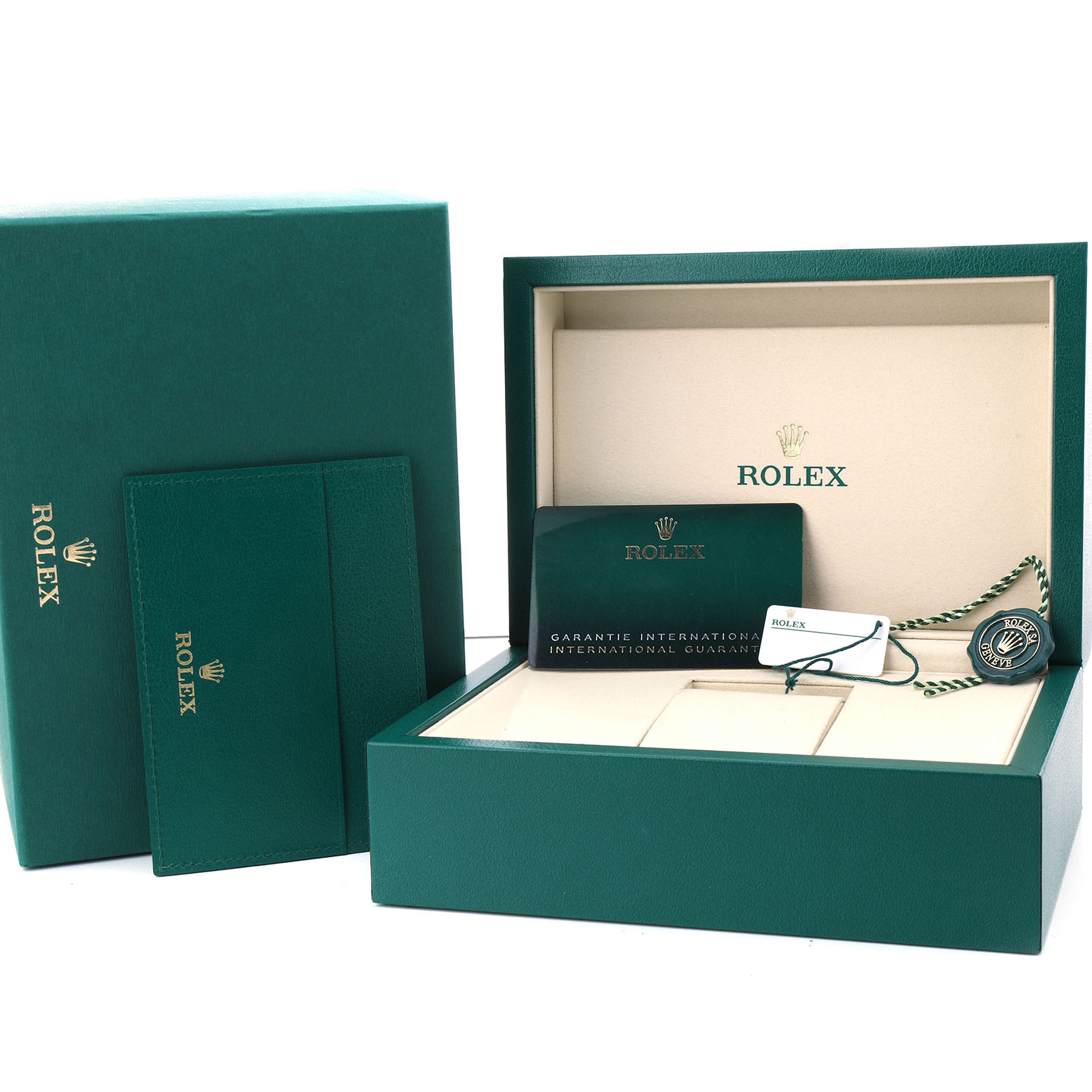 The image shows the packaging and accessories of a Rolex Oyster Perpetual 134300 Men's Stainless Steel Beige Dial, including a box, cardholder, guarantee card, and tag.