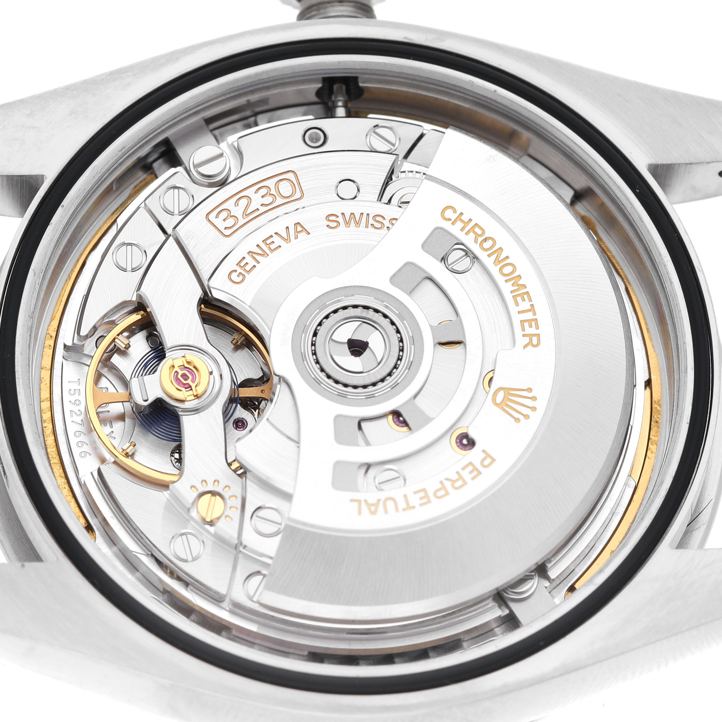 The image shows the back view of a Rolex Oyster Perpetual 134300 Men's Stainless Steel Beige Dial, revealing its internal movement with clear engravings.