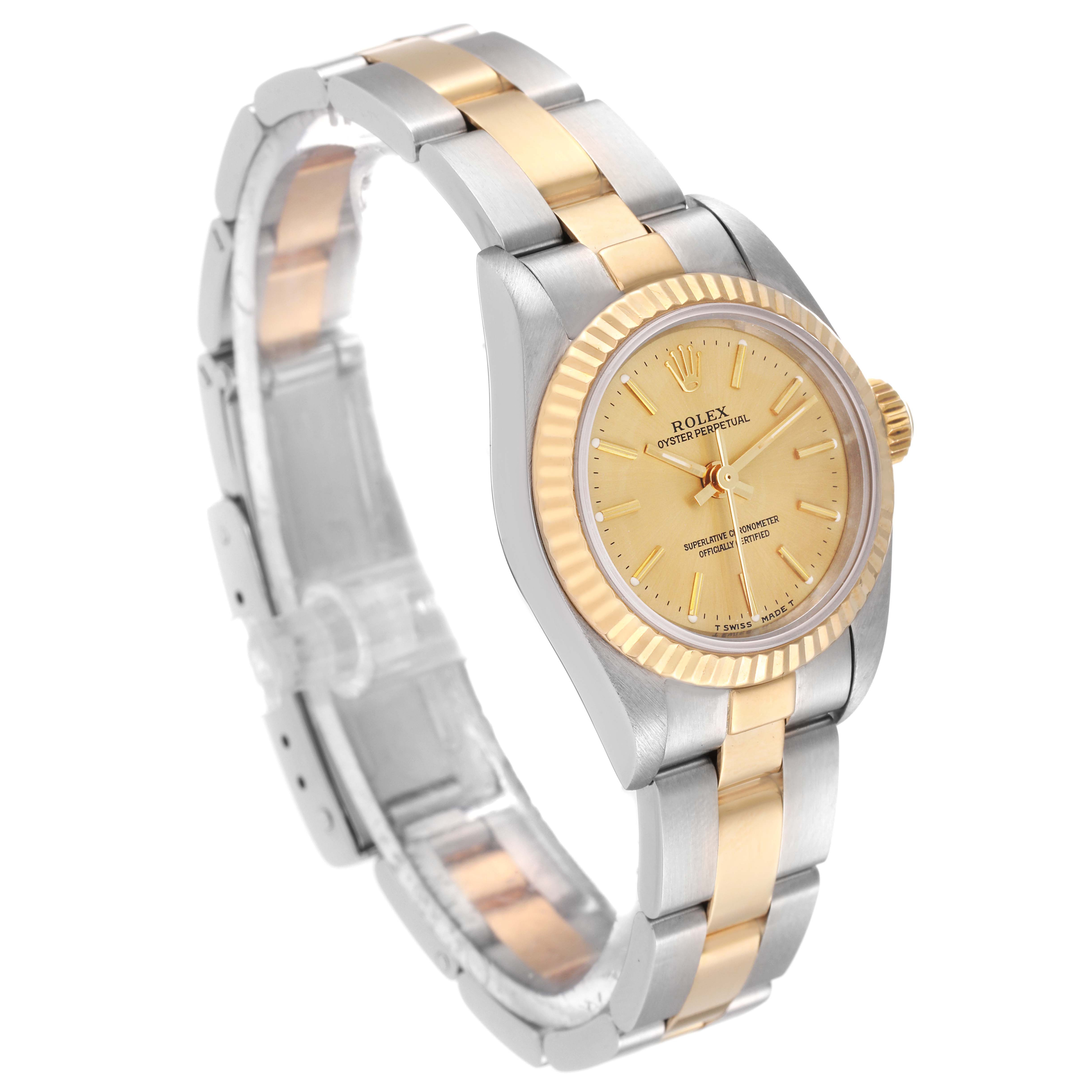 This Rolex Oyster Perpetual 67193 Women
s Steel and Gold (two tone) Champagne Dial 67193 Women
s Steel and Gold (two tone) Champagne Dial watch is shown at a three-quarter angle, highlighting the two-tone bracelet, bezel, and dial.