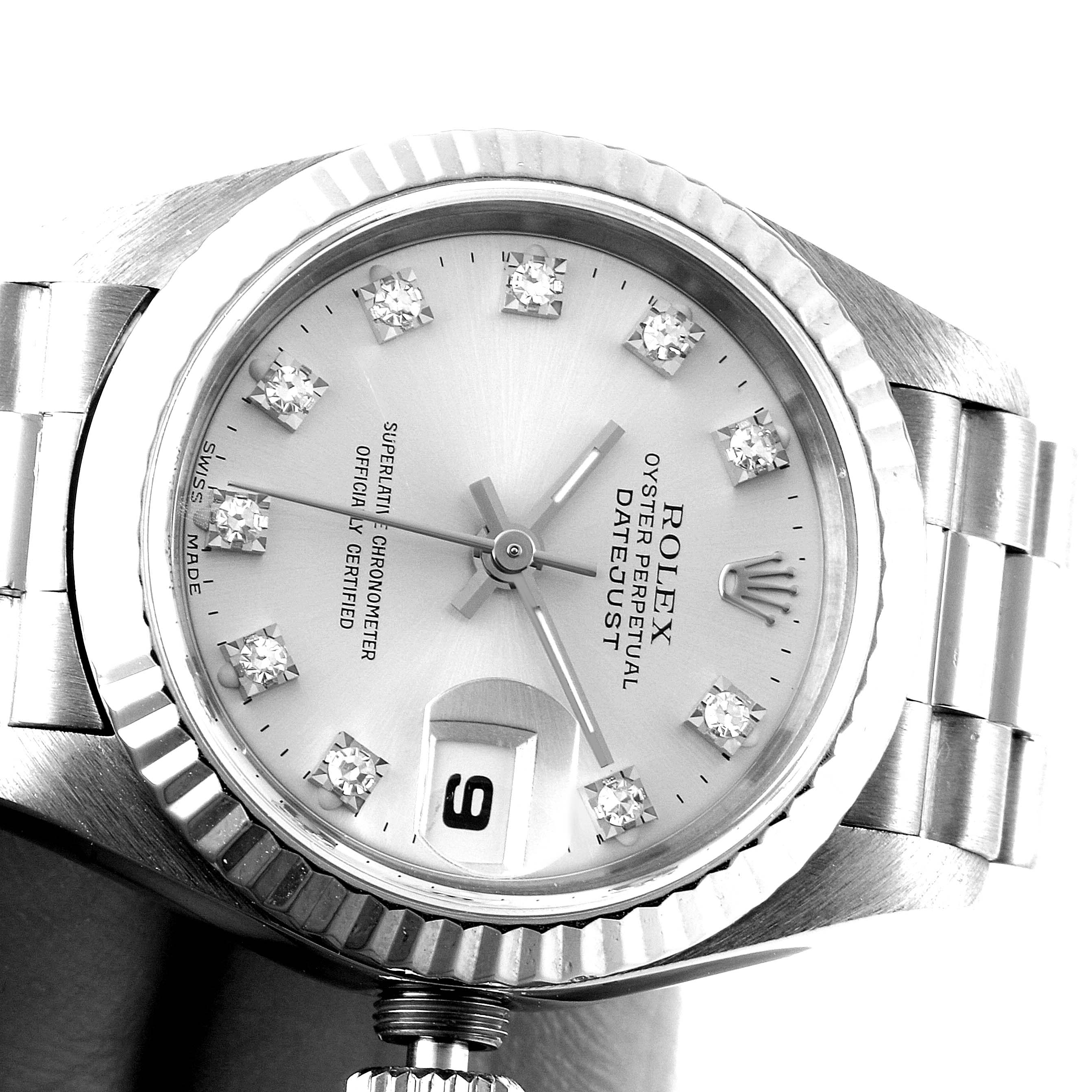 The image shows a close-up of the Rolex President 69179 Women's White Gold Silver Dial 69179 Women's White Gold Silver Dial Datejust watch face and part of the band and crown.