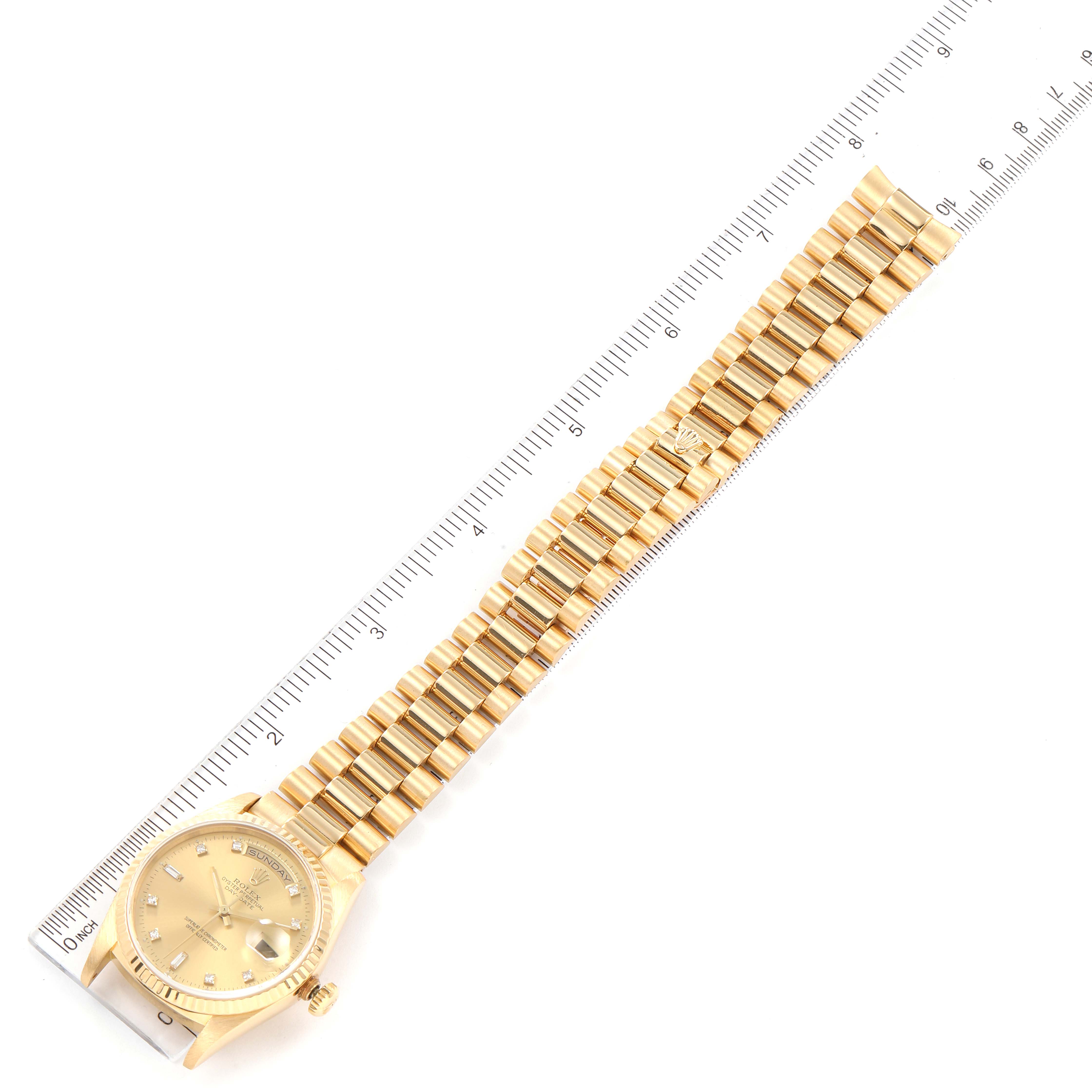The image shows a Rolex President 18238 Men's Yellow Gold Champagne Dial 18238 Men's Yellow Gold Champagne Dial model watch lying flat, with the face and bracelet fully visible, alongside a ruler for scale.