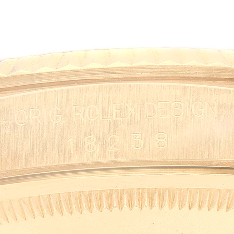 This close-up image shows the engraved details on the case back of the Rolex President 18238 Men
s Yellow Gold Champagne Dial 18238 Men
s Yellow Gold Champagne Dial model, including the design number 18238.