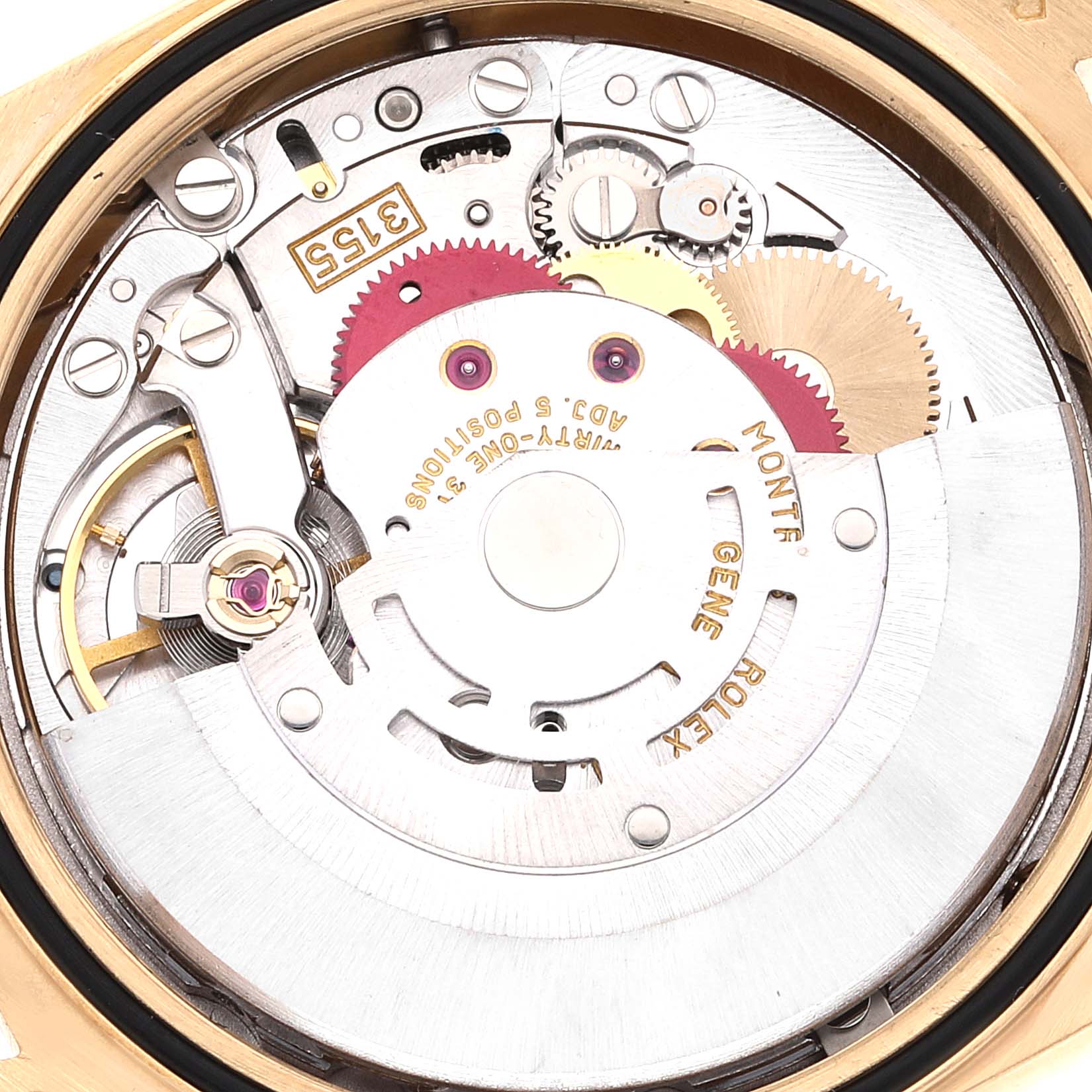 Close-up of the movement mechanism inside a Rolex President 18238 Men
s Yellow Gold Champagne Dial 18238 Men
s Yellow Gold Champagne Dial model watch, showcasing gears and inscriptions.