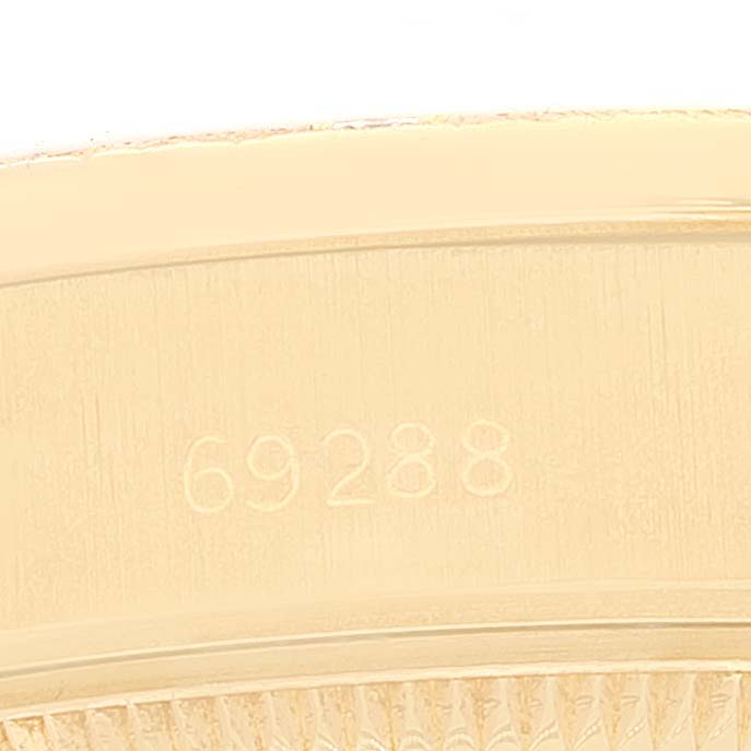 This close-up image shows the inner side of the bezel with the reference number "69288" of a Rolex President 69288 Women's Yellow Gold Brown Dial 69288 Women's Yellow Gold Brown Dial model watch.