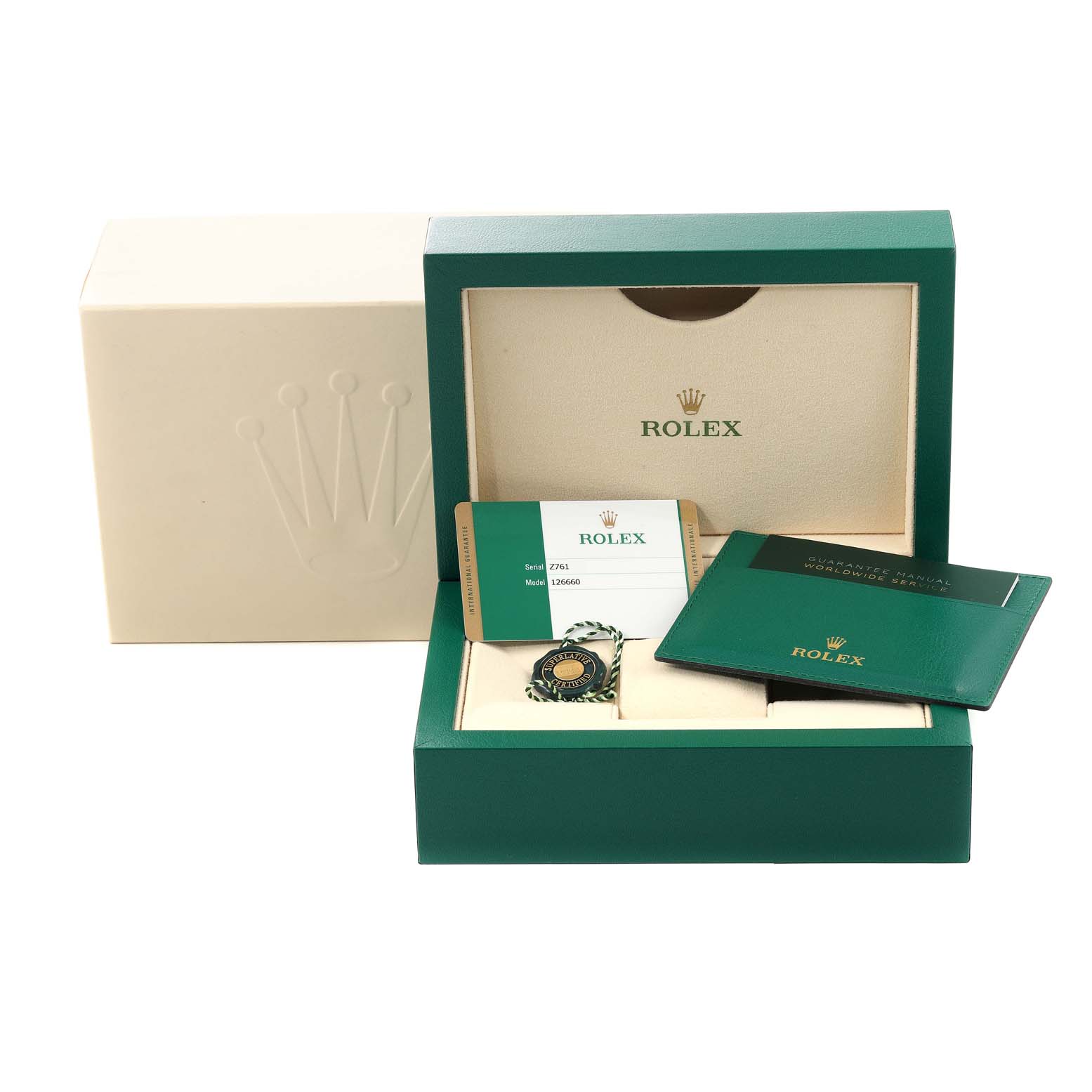 The image shows the packaging of a Rolex Sea-Dweller 126660 Men
s Stainless Steel Blue Dial 126660 Men
s Stainless Steel Blue Dial watch, including the warranty card, manual, and presentation box from a frontal angle.