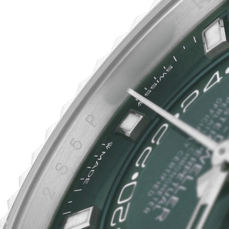 This image shows a close-up of the Rolex Sky-Dweller 336934 Men's Stainless Steel Green Dial's green dial, focusing on the bezel and a portion of the hour markers.