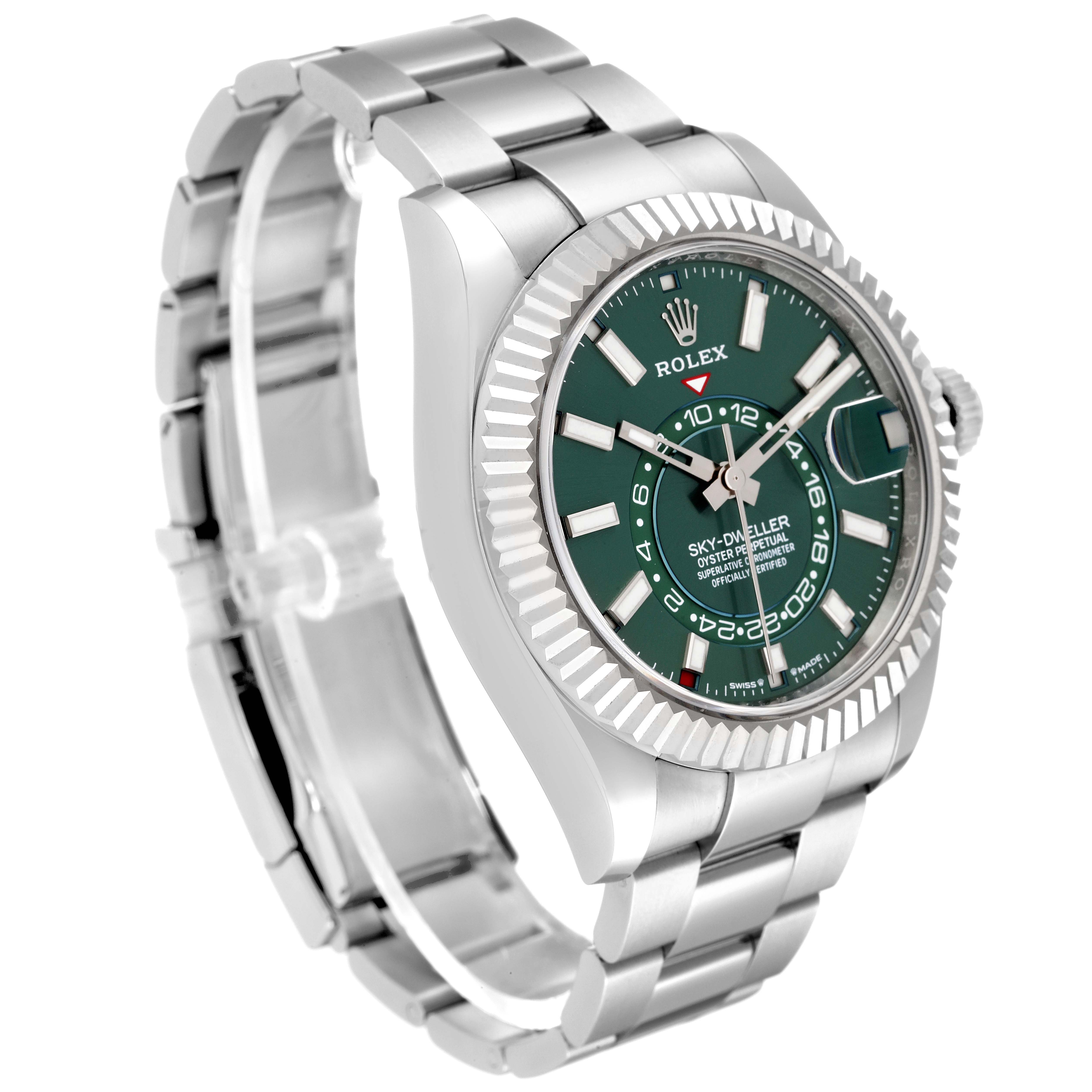 This image shows a Rolex Sky-Dweller 336934 Men
s Stainless Steel Green Dial 336934 Men
s Stainless Steel Green Dial watch at a three-quarter angle, highlighting its silver bracelet, green dial, and fluted bezel.