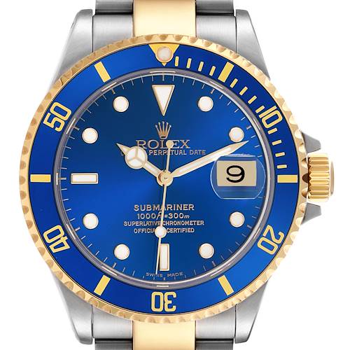 The image shows a frontal view of a Rolex Submariner, highlighting its blue dial and gold bezel.