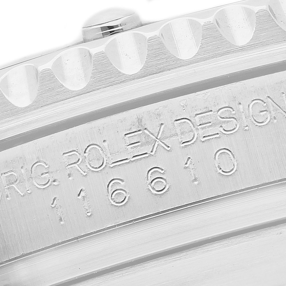 The image shows a close-up of the case side engraving of a Rolex Submariner 116610LV Men's Stainless Steel Green Dial, displaying model details.