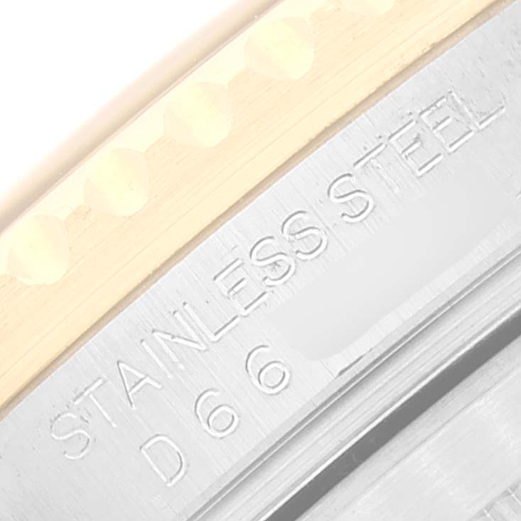 This close-up angle shows the engraved "STAINLESS STEEL" marking on the Rolex Submariner 16613 Men
s Steel and Gold (two tone) Black Dial 16613 Men
s Steel and Gold (two tone) Black Dial watch case.