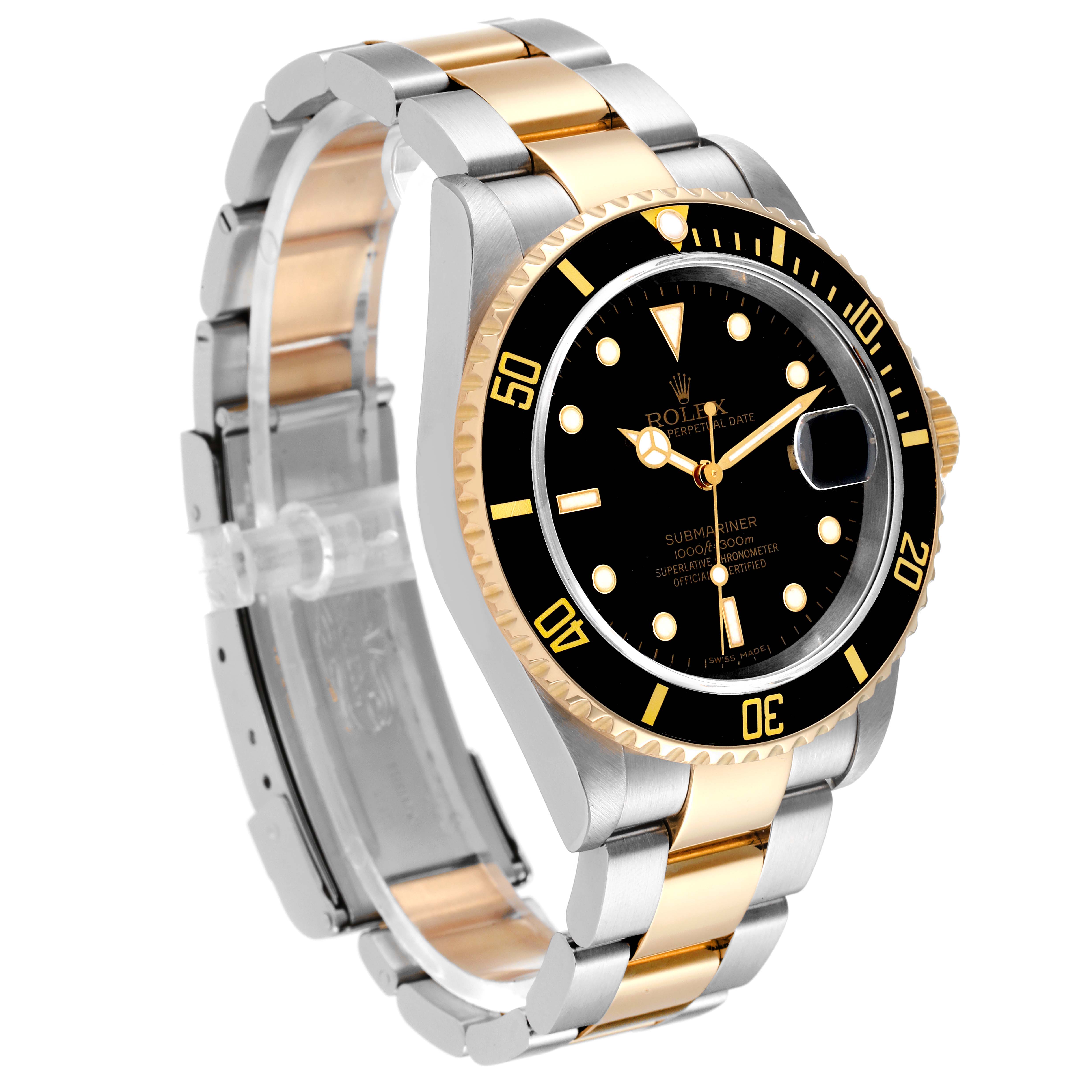 The image shows a Rolex Submariner 16613 Men
s Steel and Gold (two tone) Black Dial 16613 Men
s Steel and Gold (two tone) Black Dial watch at a three-quarter angle, highlighting its two-tone bracelet, bezel, and dial.