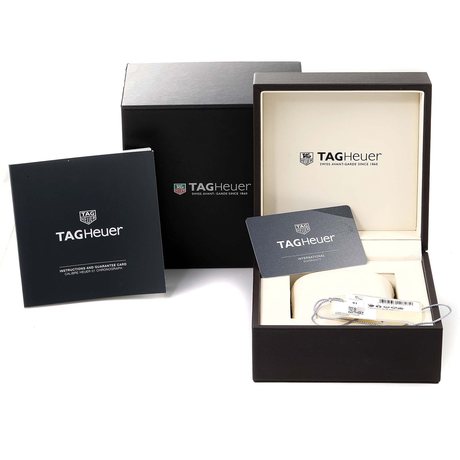 The image shows the Tag Heuer Carrera CAR201V.BA0714 Men's Stainless Steel Black Dial CAR201V.BA0714 Men's Stainless Steel Black Dial watch packaging, including the outer box, inner display box, manual, and warranty card.