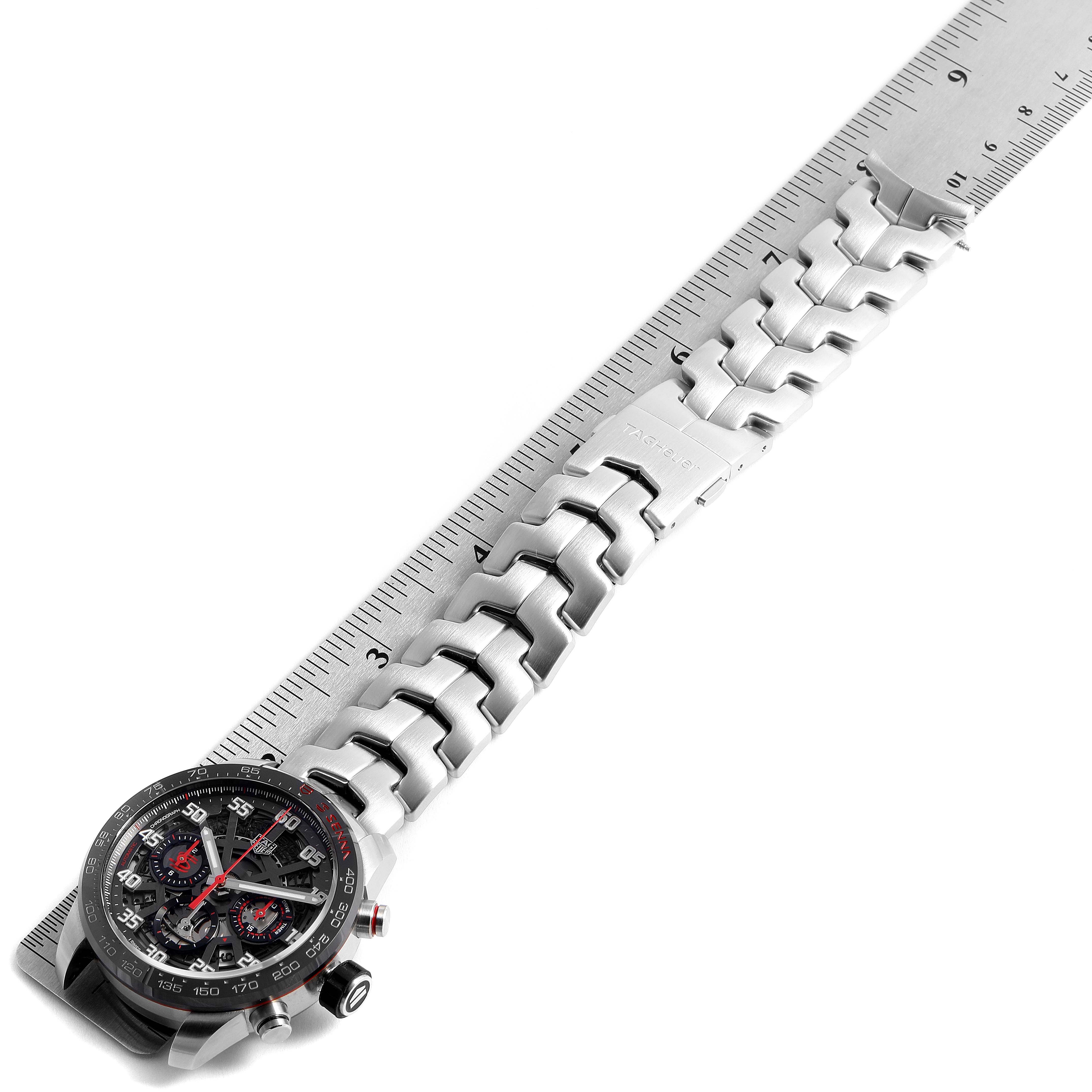 The Tag Heuer Carrera CBG2013.BA0657 Men's Stainless Steel Transparent Dial CBG2013.BA0657 Men's Stainless Steel Transparent Dial watch is shown flat with a ruler, displaying the face, bezel, and metal bracelet.