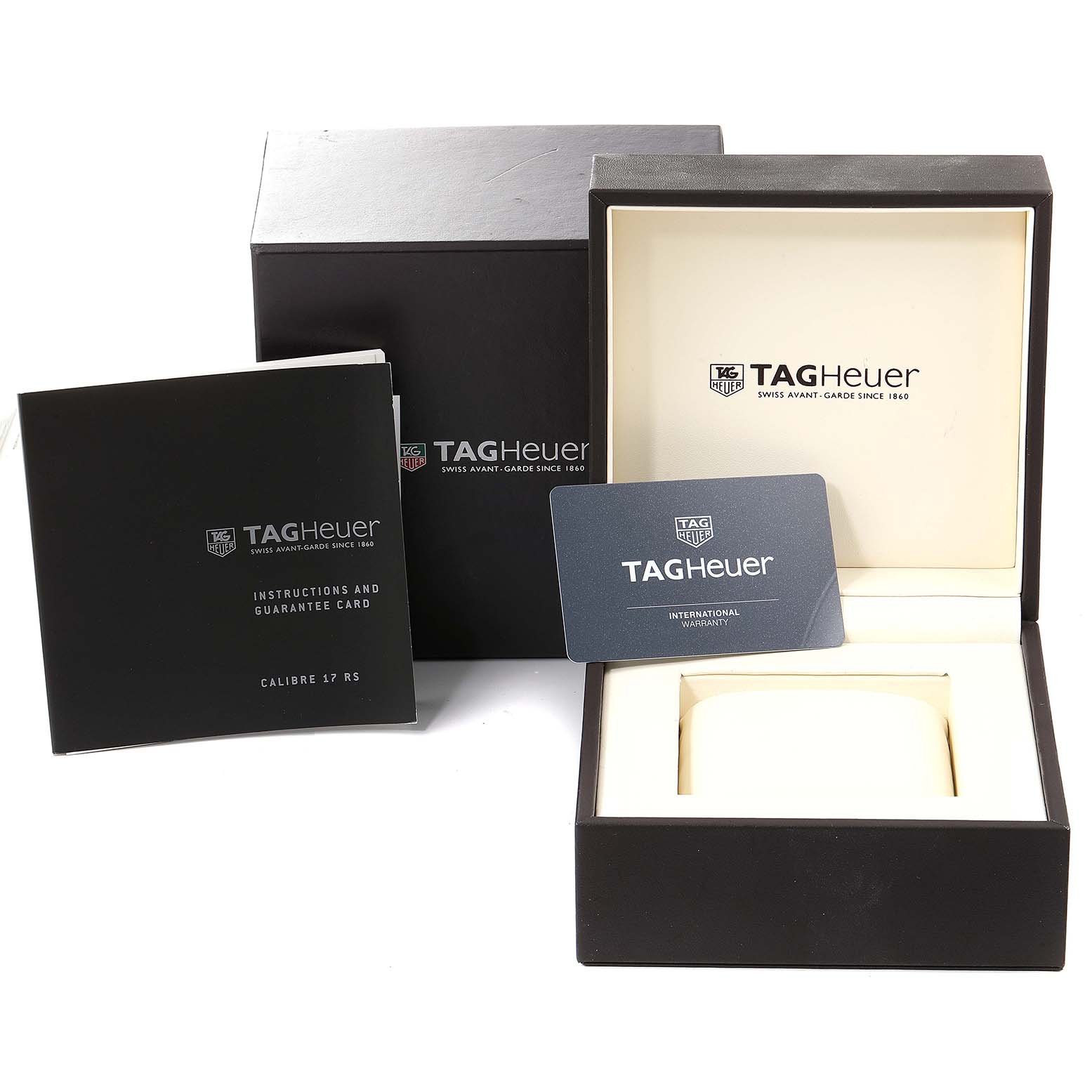 The image shows the packaging, instruction manual, guarantee card, and warranty card for the Tag Heuer Carrera CAV518B.FT6016 Men
s Titanium Black Dial CAV518B.FT6016 Men
s Titanium Black Dial watch model.