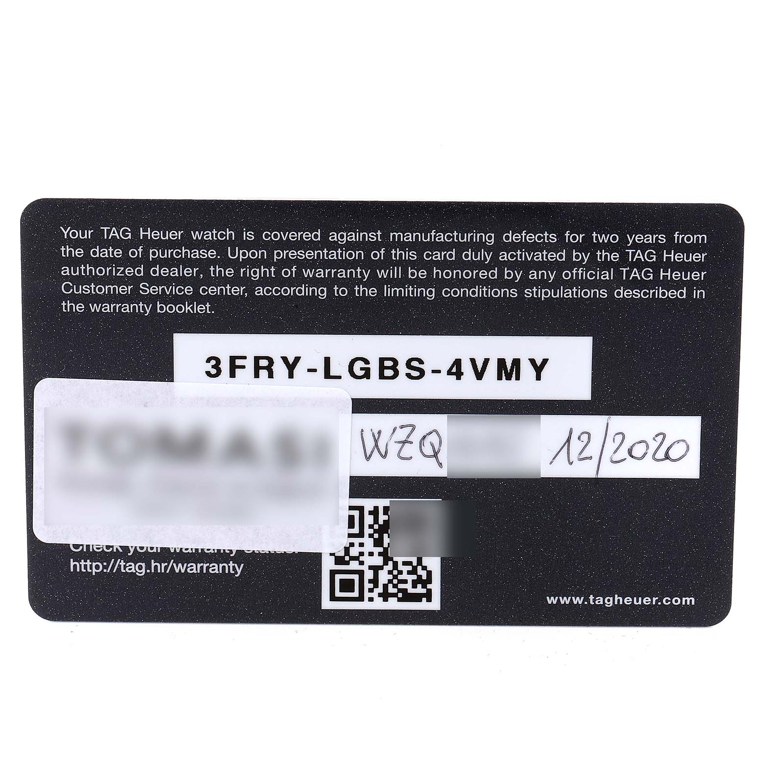 The image shows a close-up of the warranty card for the Monaco model by Tag Heuer.