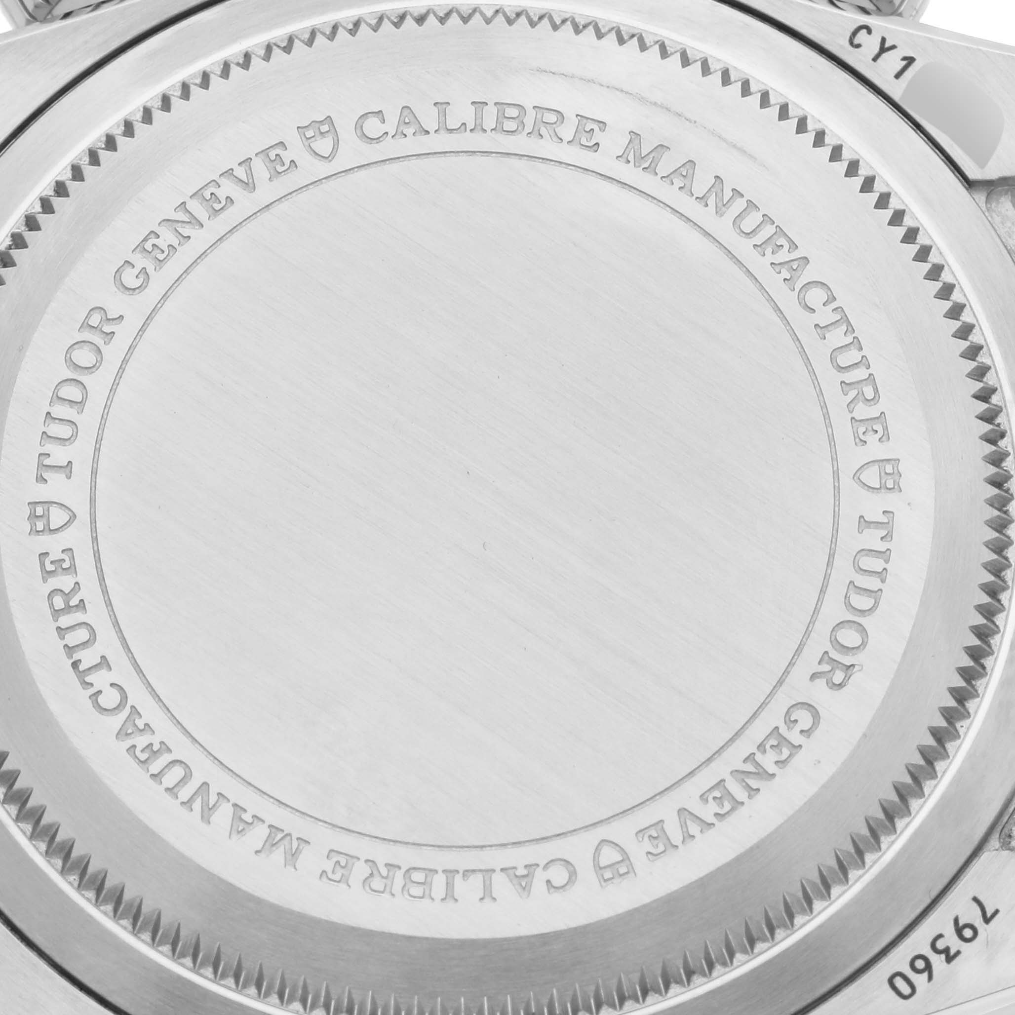 The image shows the stainless steel case back of the Tudor Heritage Black Bay 79360 Men's Stainless Steel White Dial 79360 Men's Stainless Steel White Dial watch with engraved markings.