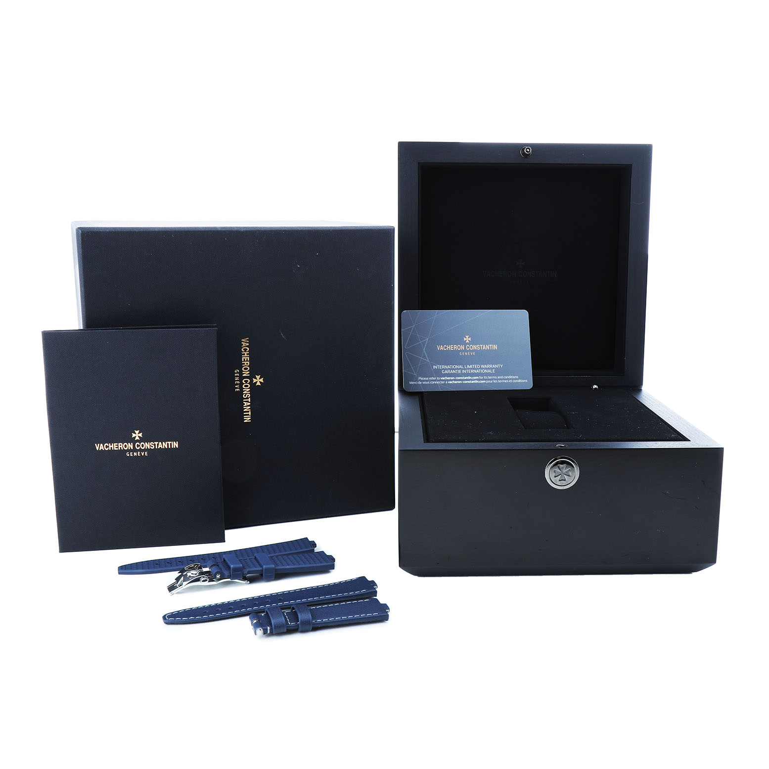 The image shows the Vacheron Constantin Overseas 4600V/200A-B980 Men's Stainless Steel Blue Dial watch package, including the box, booklet, warranty card, and blue straps.