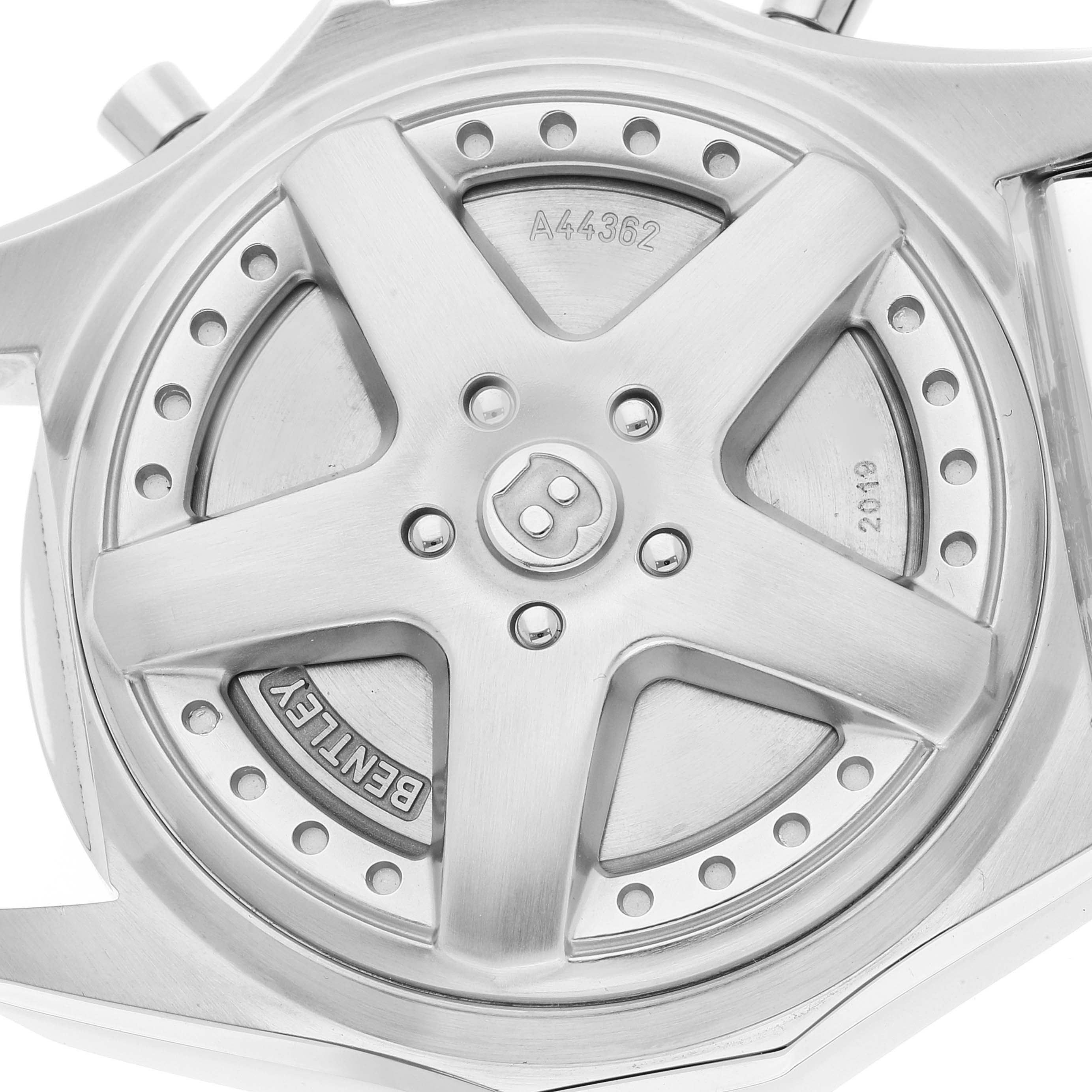 The image shows the back casing of a Bentley model by Breitling, highlighting the rotor and serial engravings.