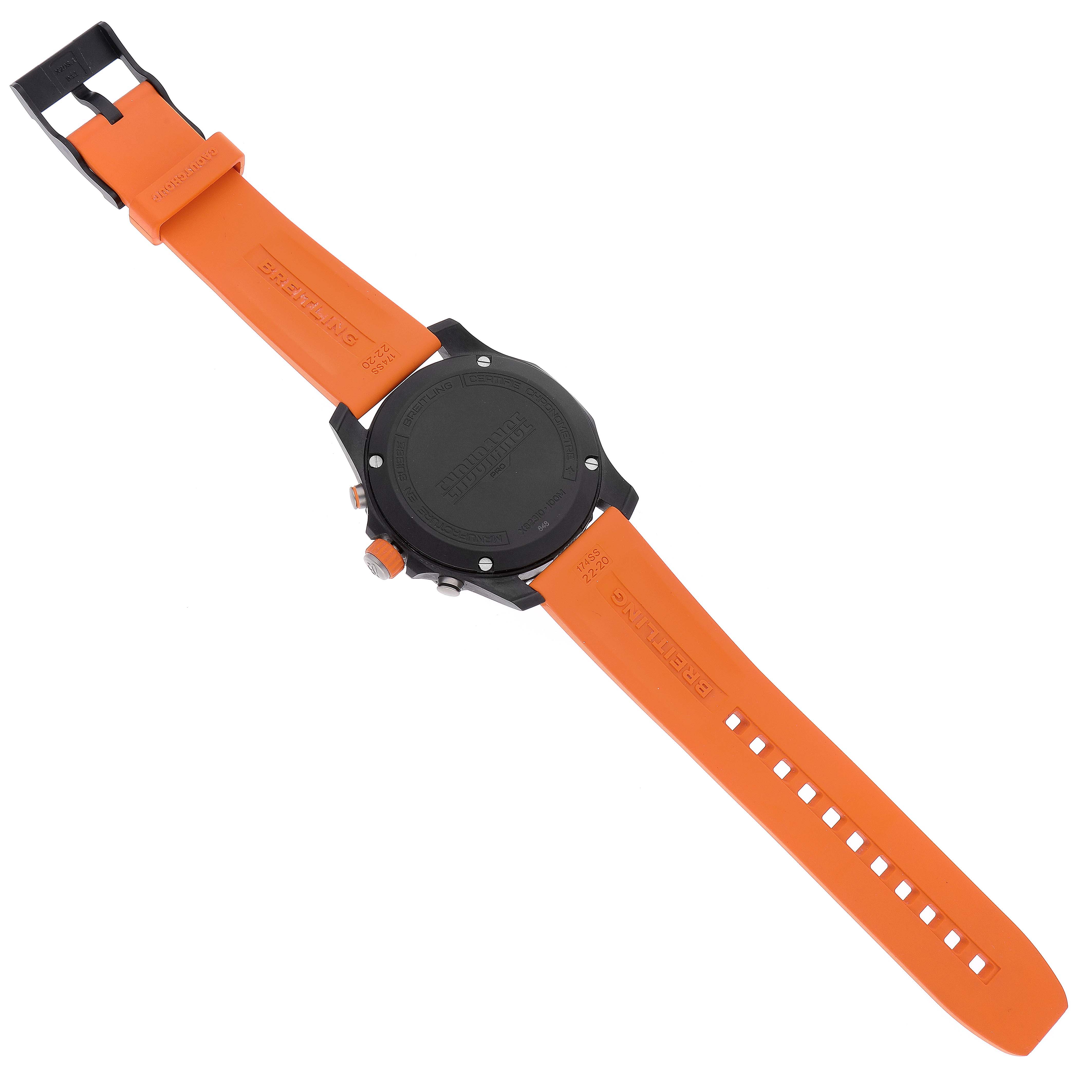 The image shows the back and orange strap of a Breitling Professional Series X82310 Men's Titanium Black Dial X82310 Men's Titanium Black Dial watch lying flat.