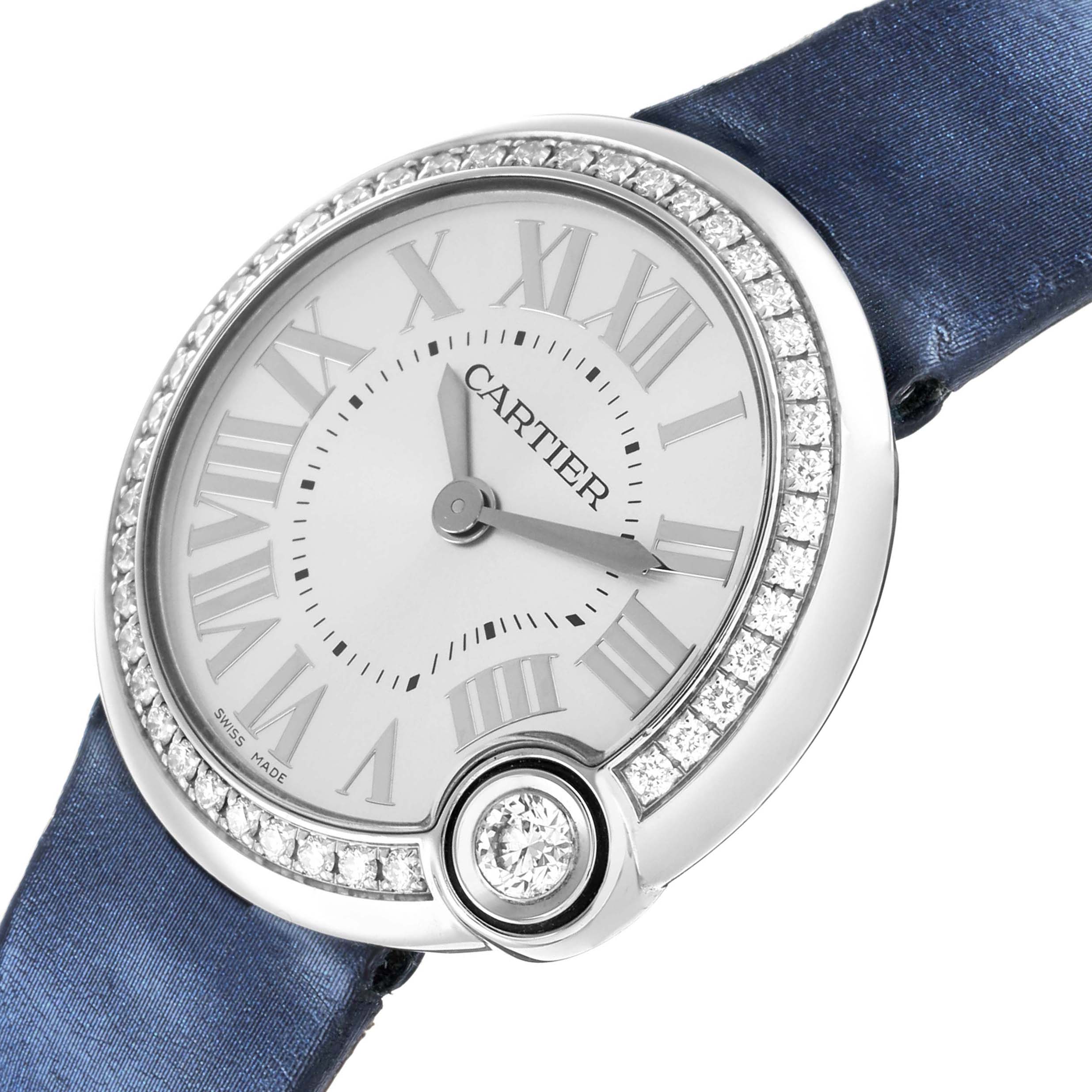 The Cartier Ballon Blanc W4BL0003 Women
s Stainless Steel Silver Dial watch is shown from an angled top view, highlighting its diamond-set bezel and blue strap.
