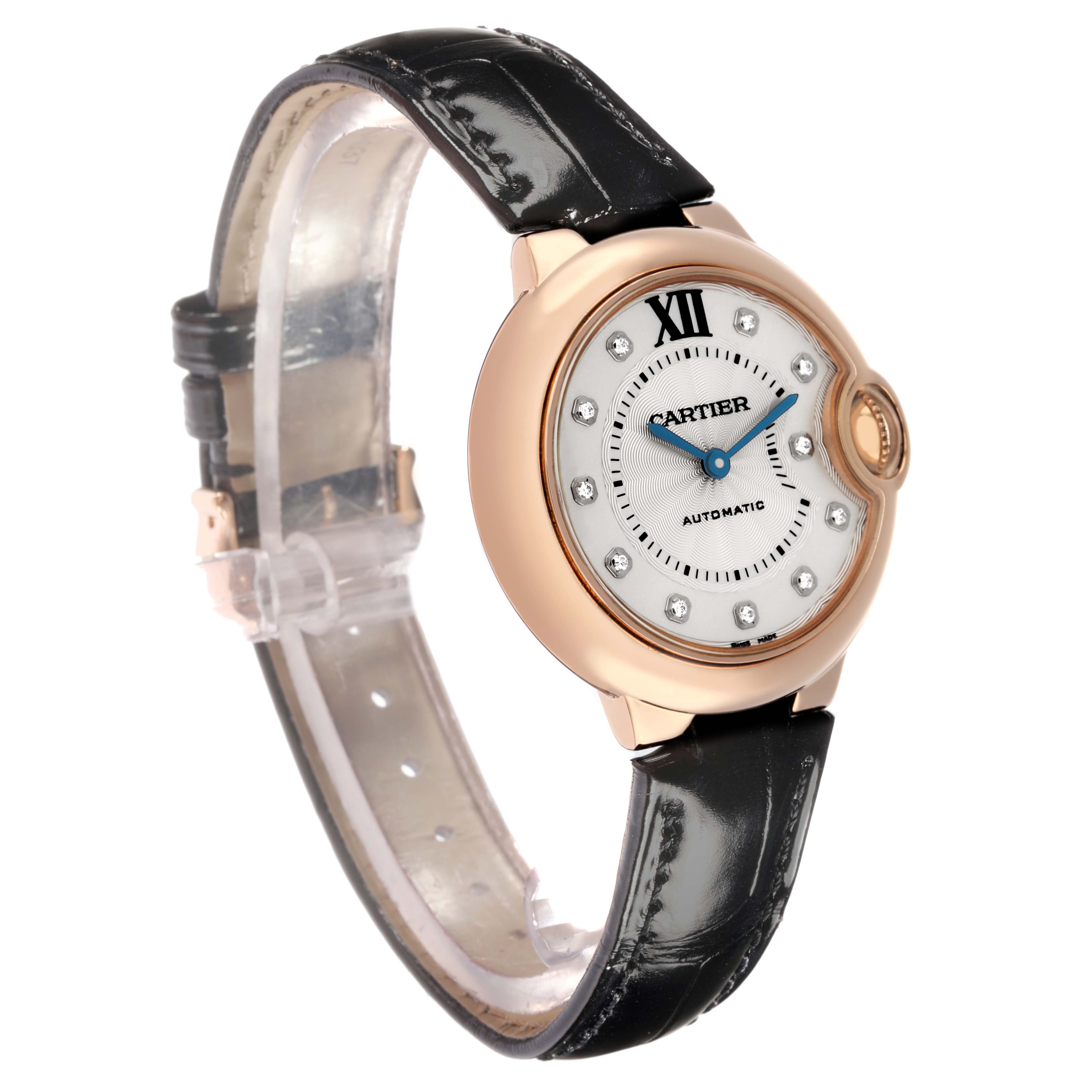 The Cartier Ballon Bleu WE902063 Women
s Rose Gold Silver Dial watch is shown from a side angle, highlighting the face, crown, case, and leather strap.