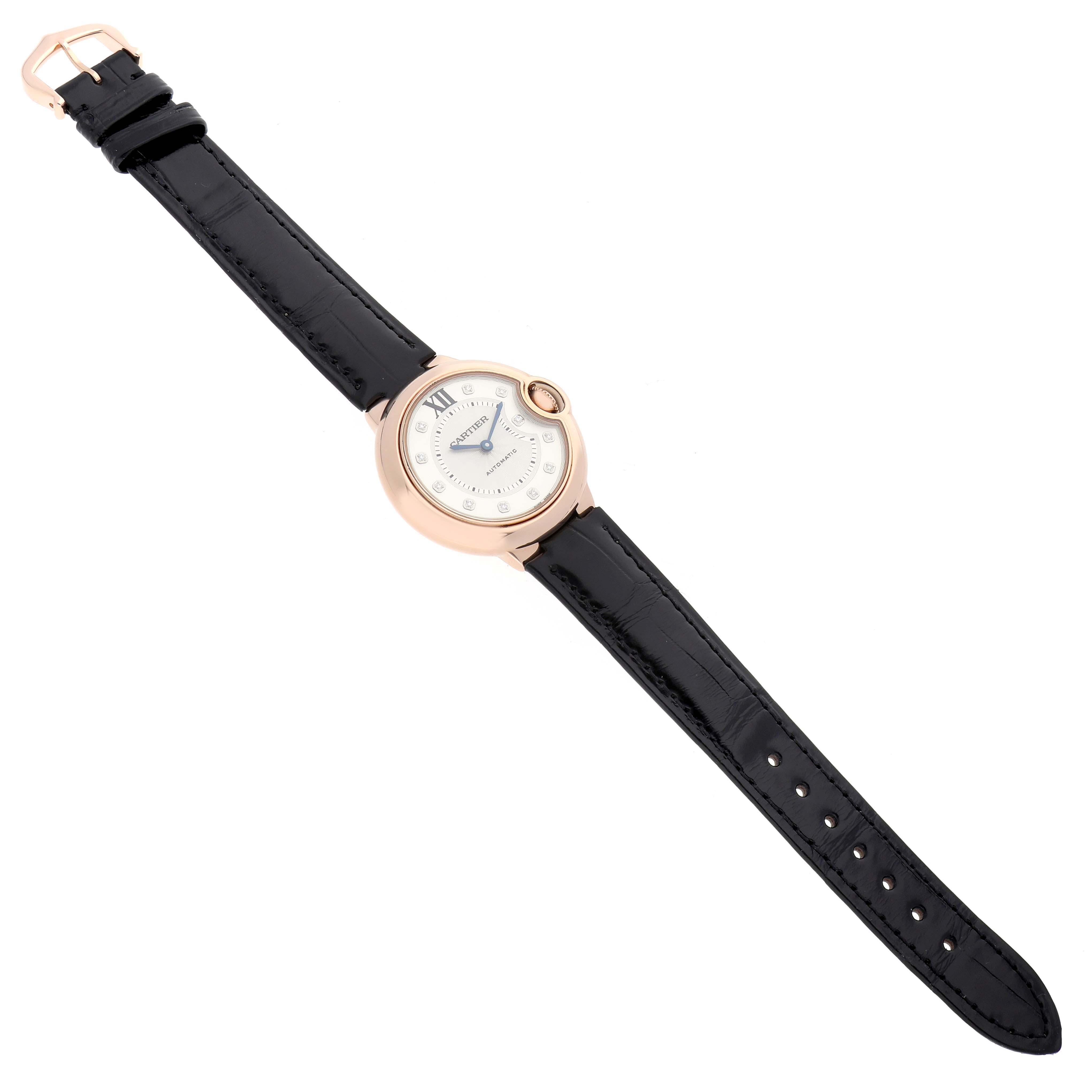 The image shows a top-down view of a Cartier Ballon Bleu WE902063 Women
s Rose Gold Silver Dial watch, highlighting its face, case, and entire strap.