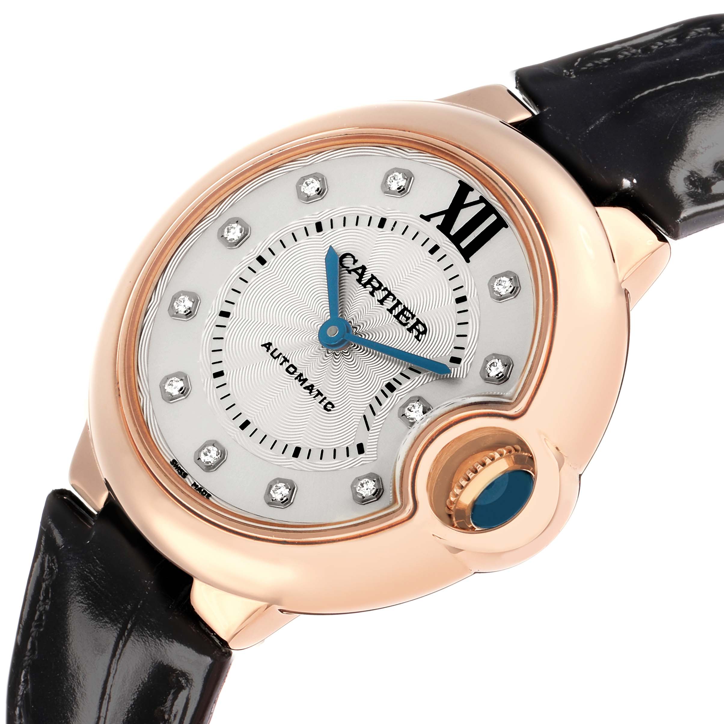 The Cartier Ballon Bleu WE902063 Women
s Rose Gold Silver Dial watch is shown at an angled view, highlighting the dial, crown, and part of the leather strap.