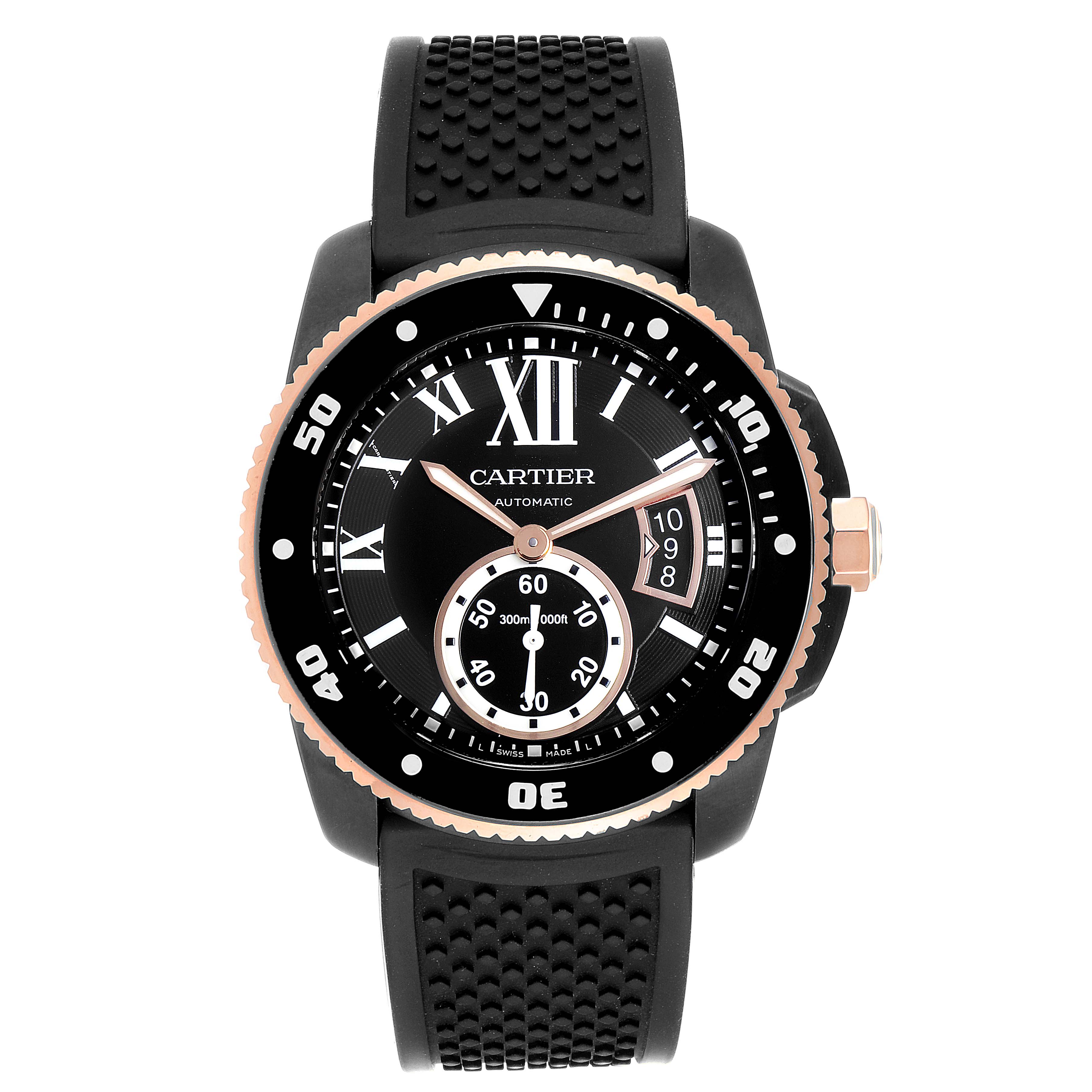 The image shows a front view of a Calibre de Cartier automatic watch by Cartier with a black rubber strap and black dial.