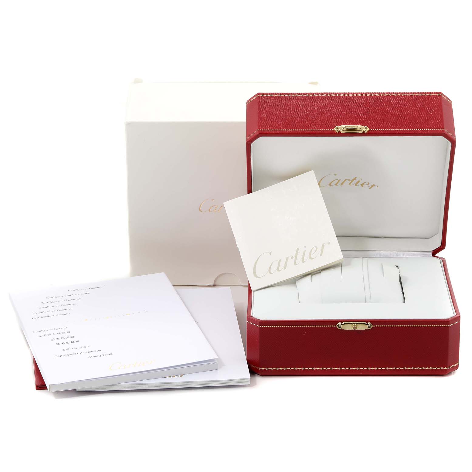 The image shows the box, papers, and packaging for a Calibre de Cartier watch by Cartier.