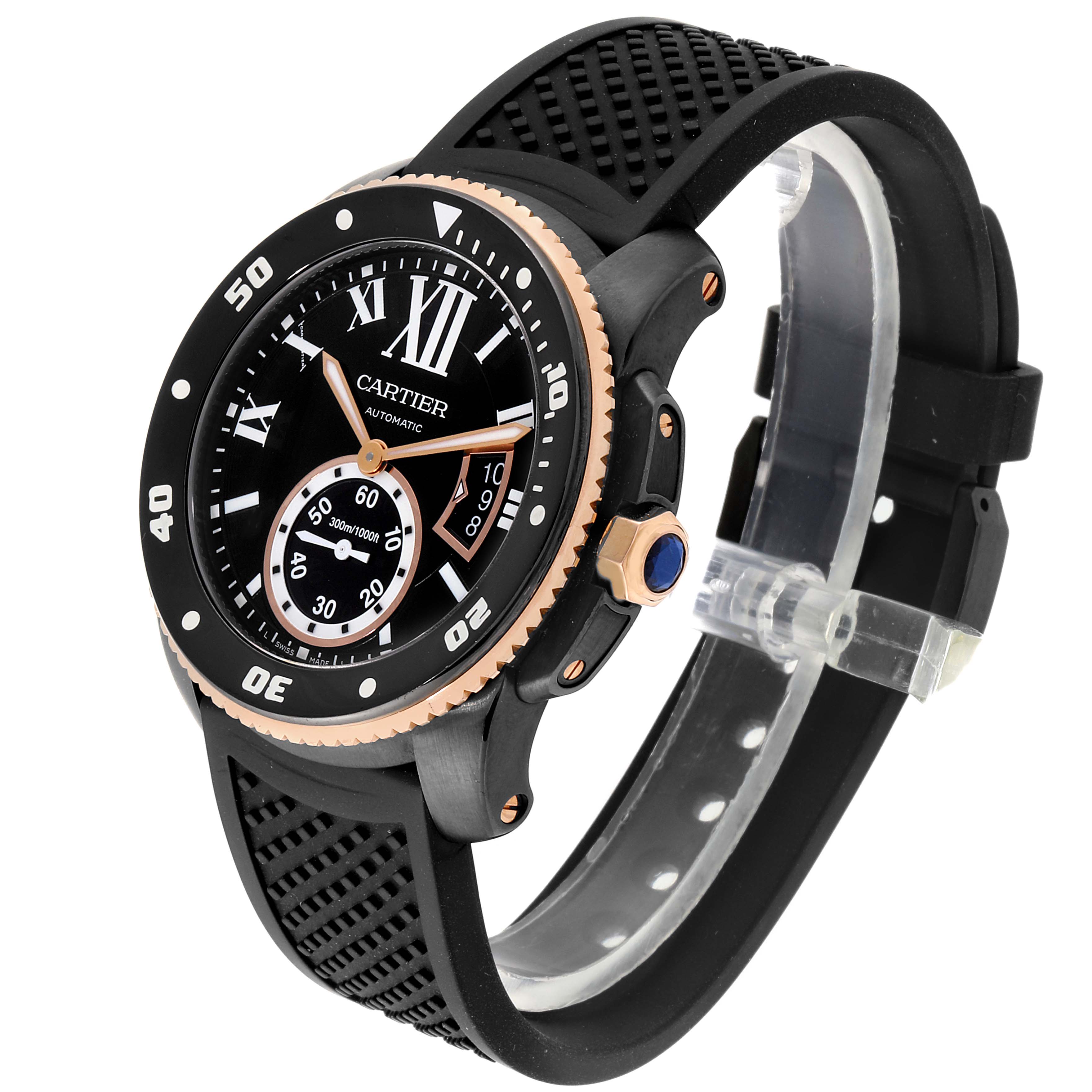 The image shows a Calibre de Cartier watch by Cartier at a three-quarter angle, displaying its face, bezel, and rubber strap.