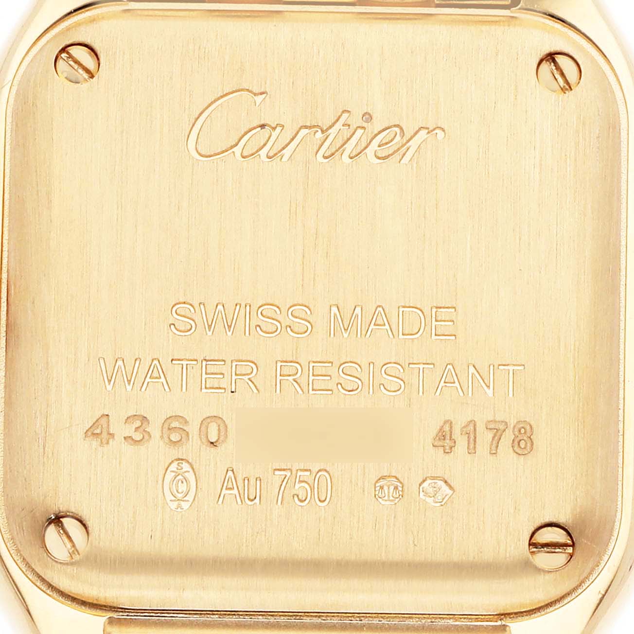 The image shows the back case of a Panthère de Cartier watch, displaying the brand logo, gold markings, and additional engravings.